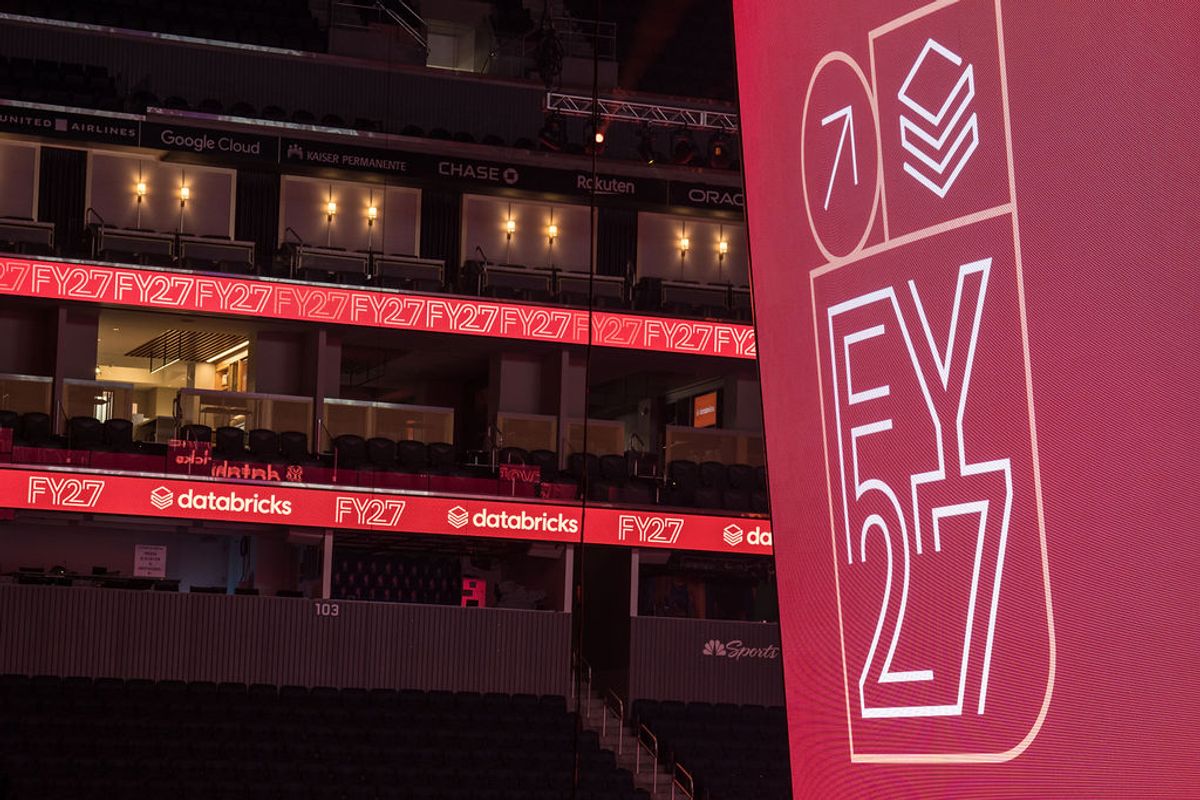 FY27 conference signage displayed on red banners at Chase Center venue with tiered seating visible