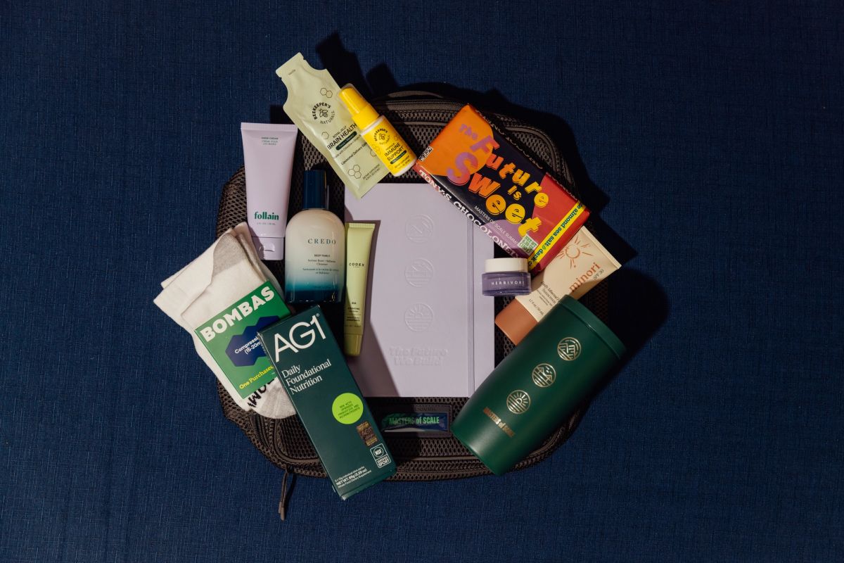 Wicker basket filled with various beauty and skincare products including tubes, bottles, and packages.