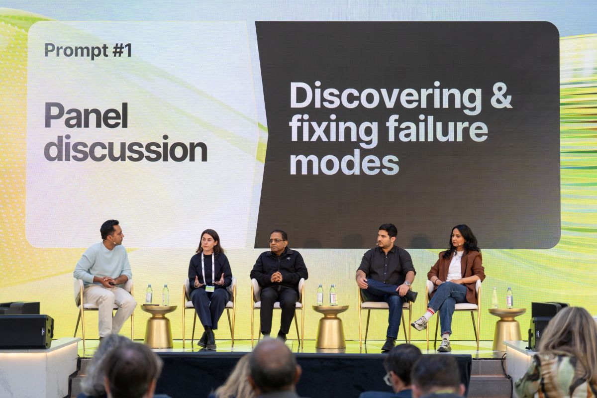 Five panelists seated on stage discuss "Discovering & fixing failure modes" at a conference.