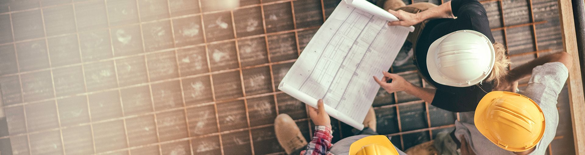 Construction workers analysing plans