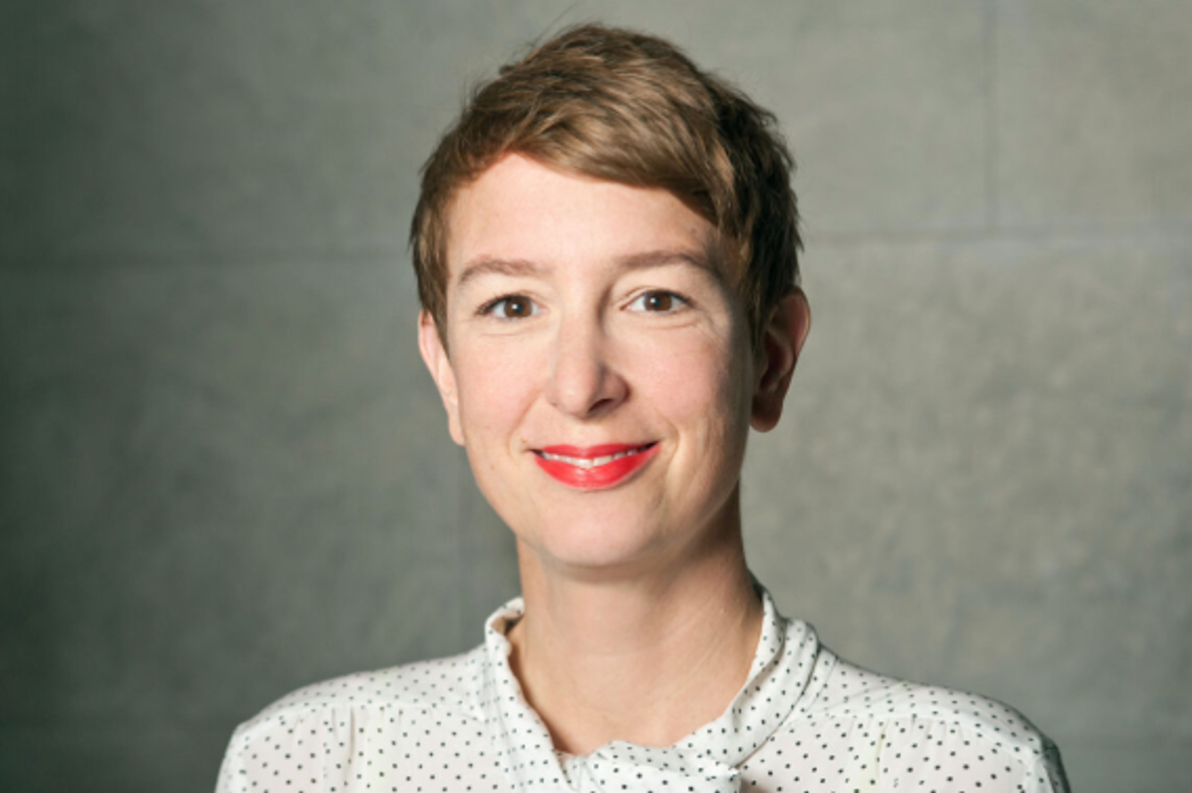 Portrait of a smiling Dr. Katja Naie, Director of the Science Program at Schering Stiftung in Berlin.