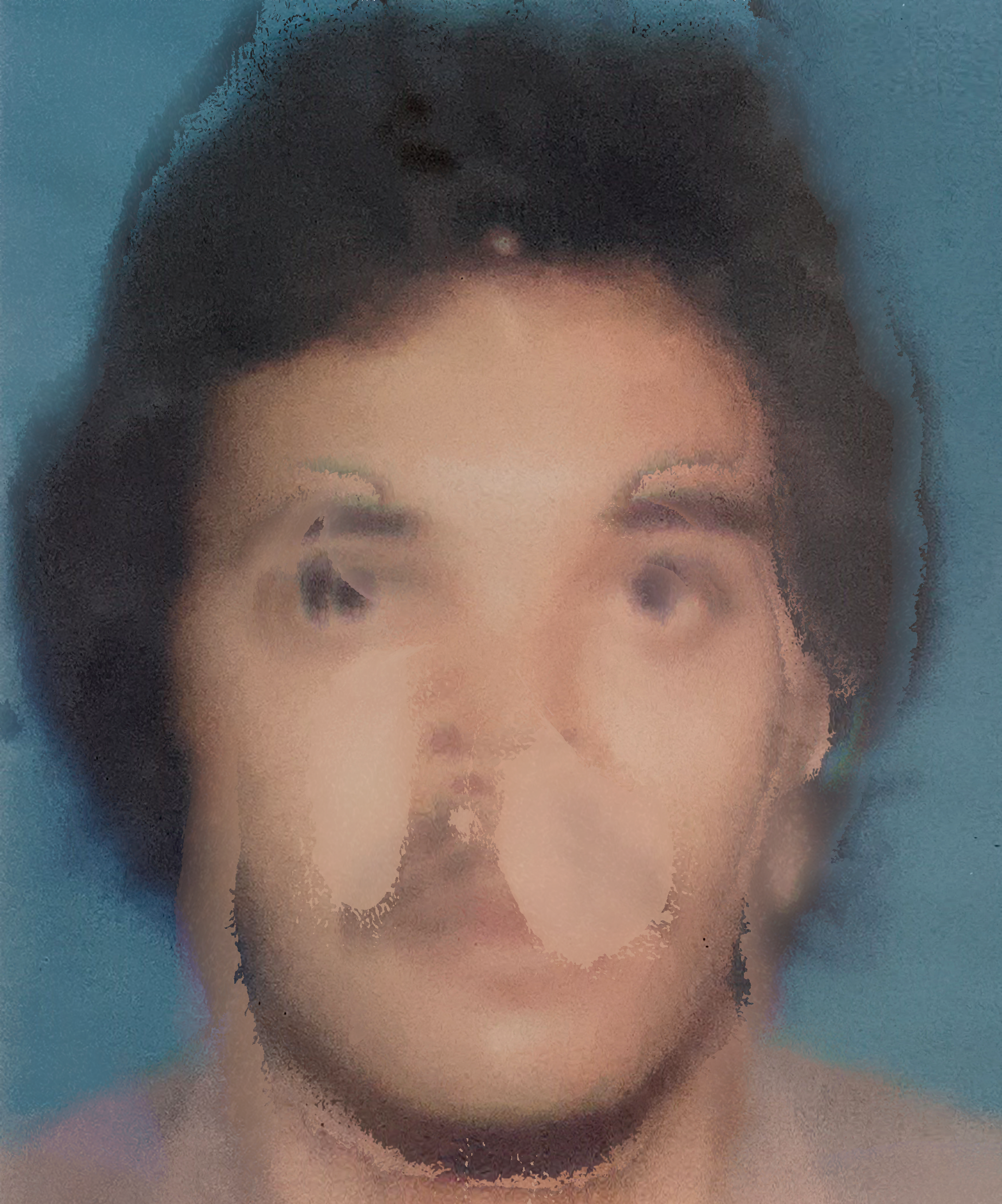 A blurry, distorted portrait of a person against a blue background. Facial features are unclear, with an obscured mouth and nose. The image appears abstract due to the heavy distortion.