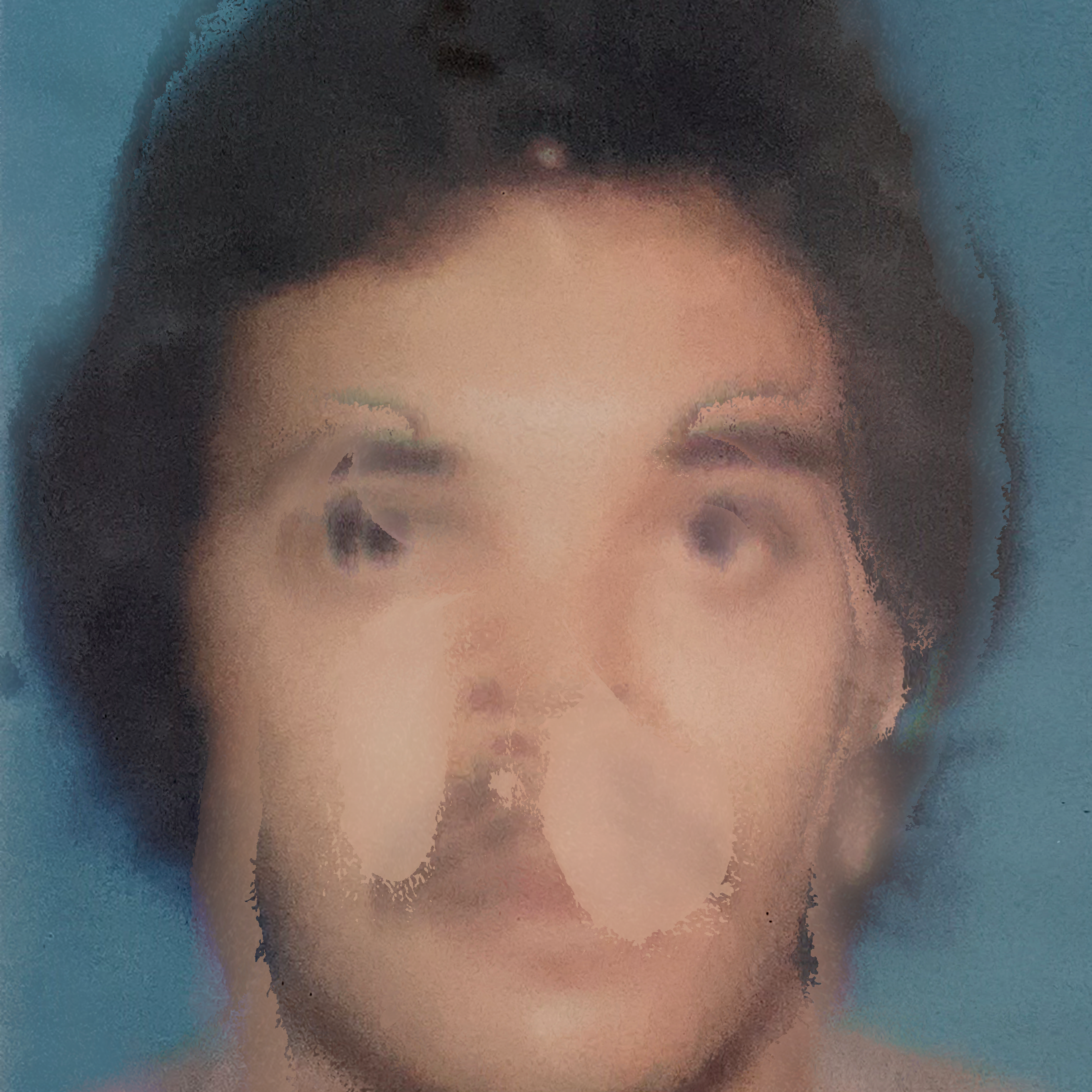 A blurry, distorted portrait of a person against a blue background. Facial features are unclear, with an obscured mouth and nose. The image appears abstract due to the heavy distortion.