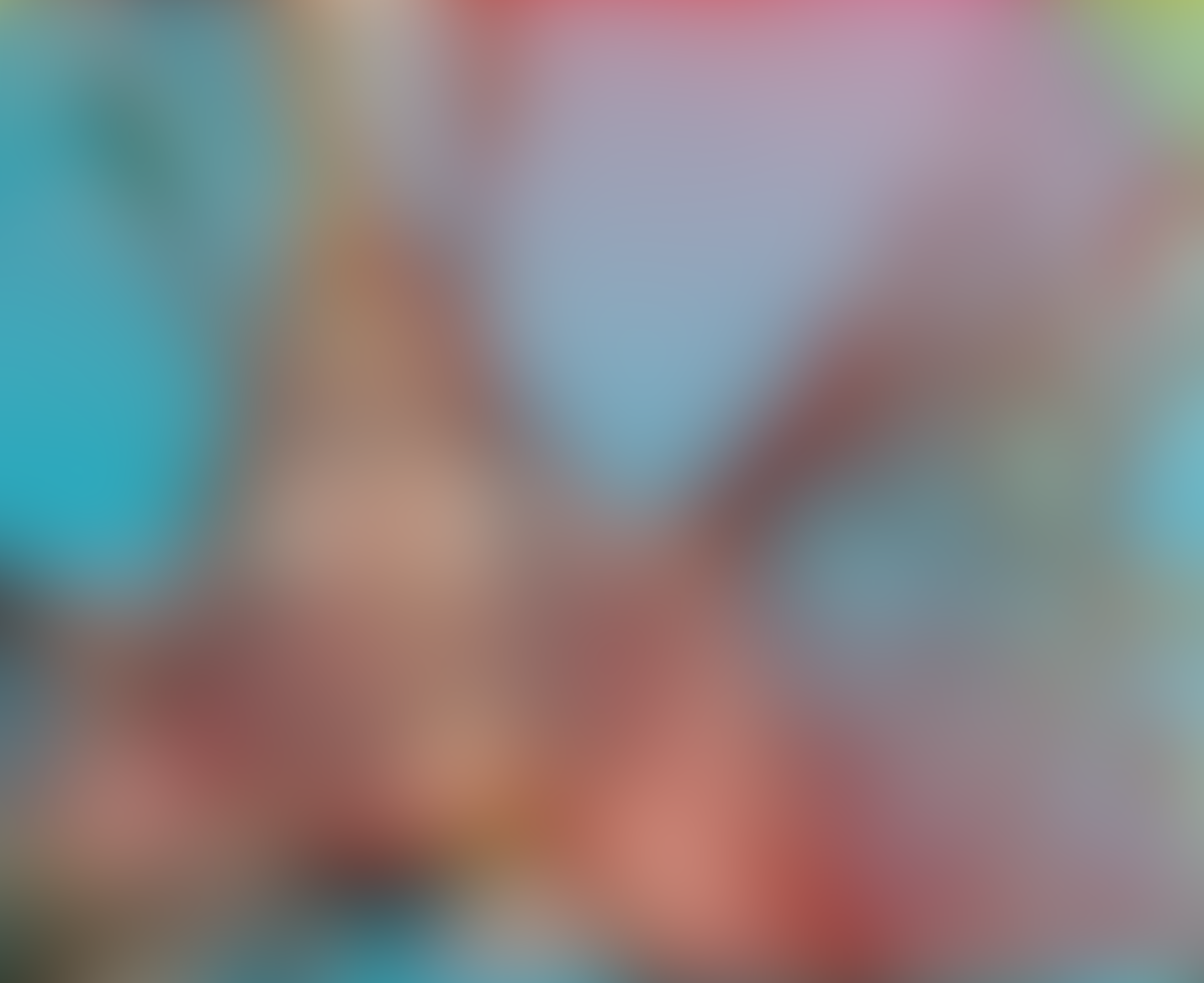 Abstract blur in pastel tones with reddish-blue gradients.