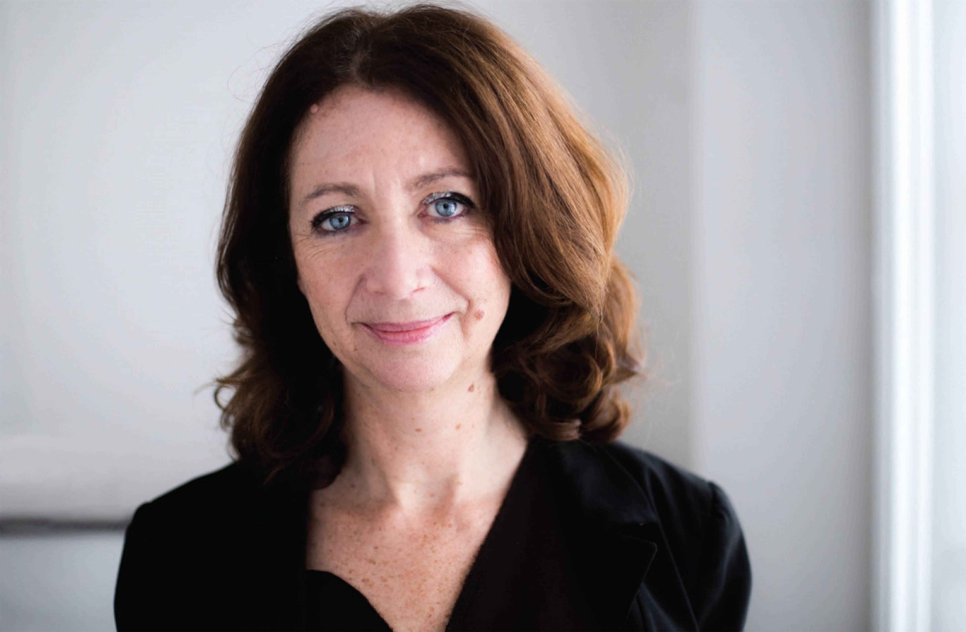 Portrait of British independent producer, curator and writer Ariane Koek.