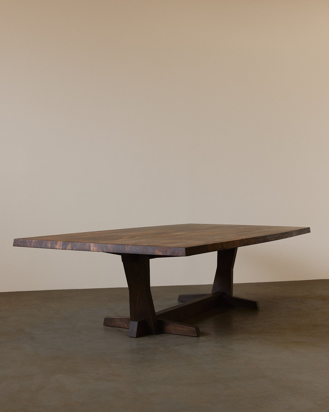 Bookmatch dining table in Claro Walnut