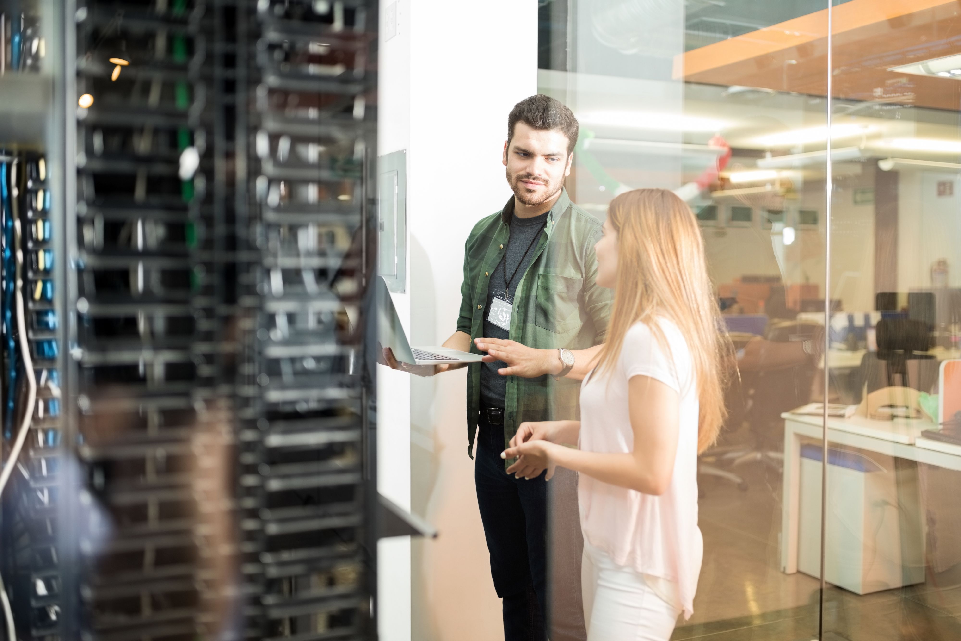 IT workers inspect a server