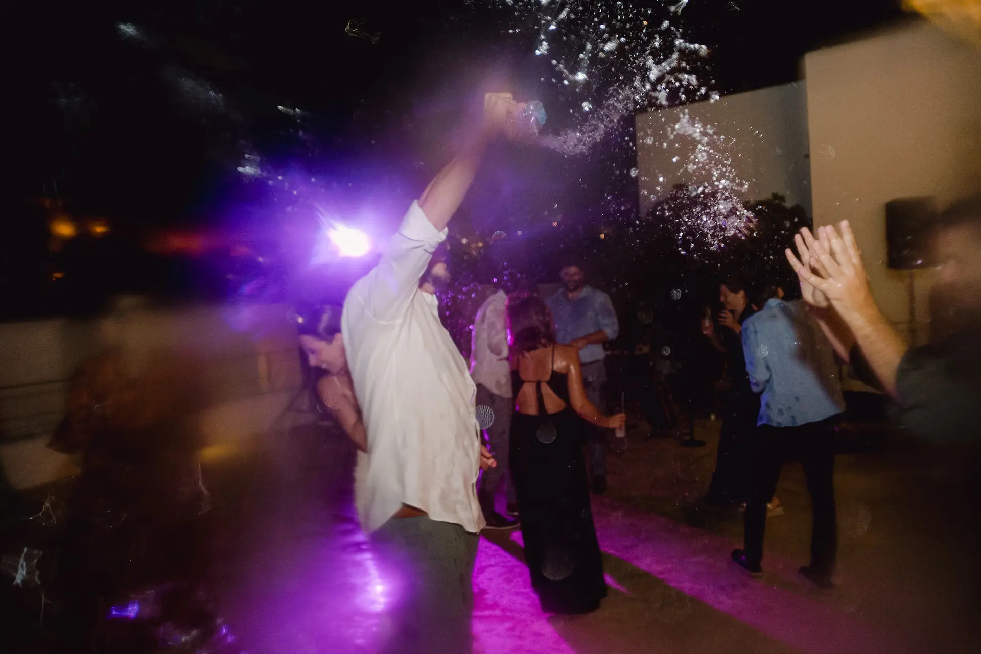 a man throwing water in the air