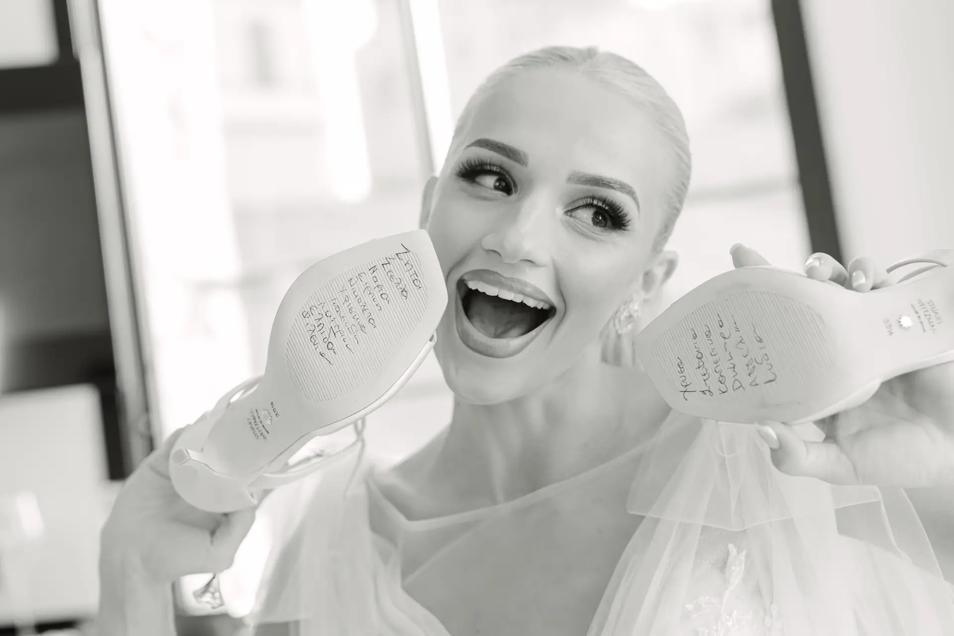 bride with her bridal shoes