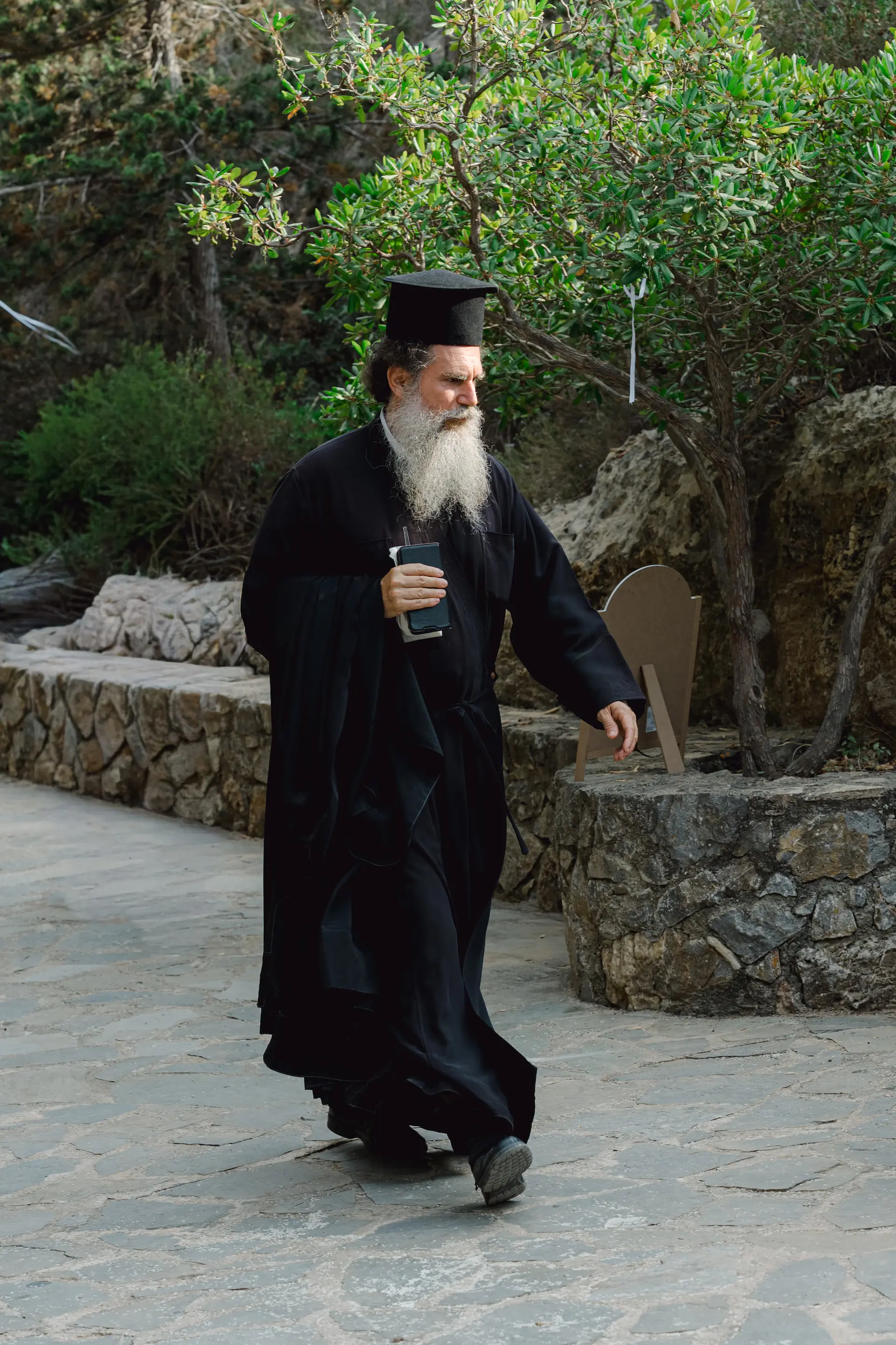 orthodox priest walking to the church