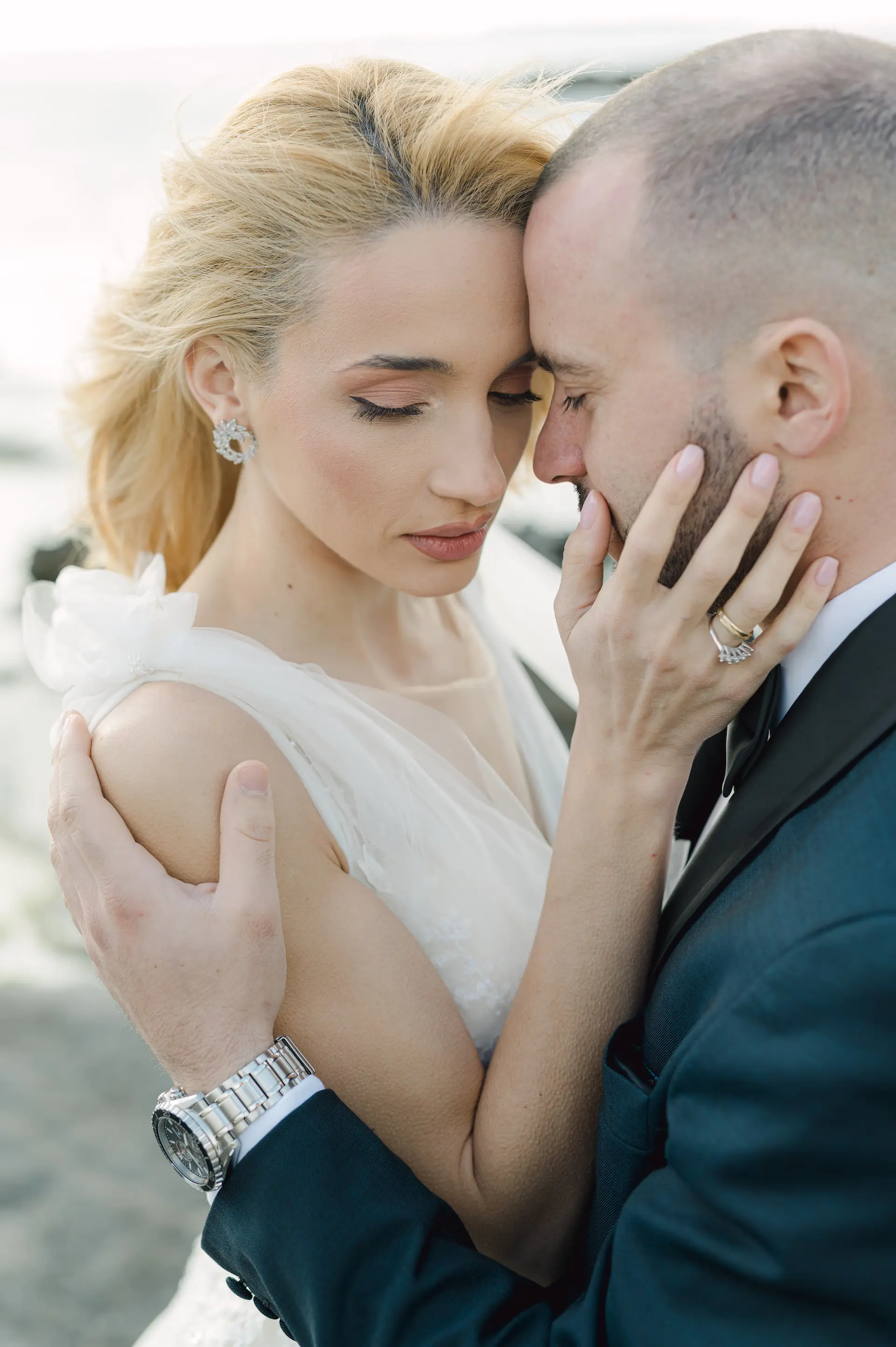 Intimate moment of bride and groom holding each other closely.