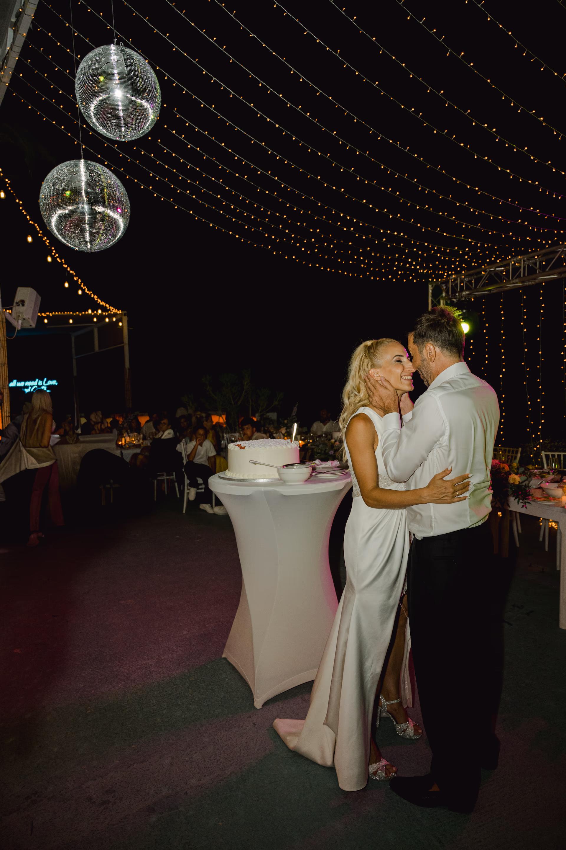 a man and woman dancing at a party