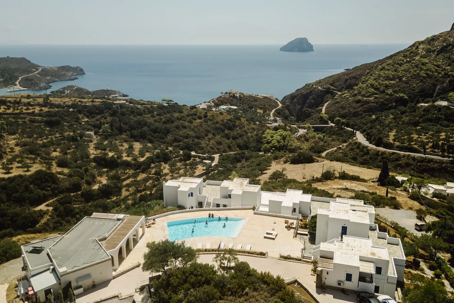 Drone view of a luxury wedding hotel in Kythira with a swimming pool and Aegean Sea view.