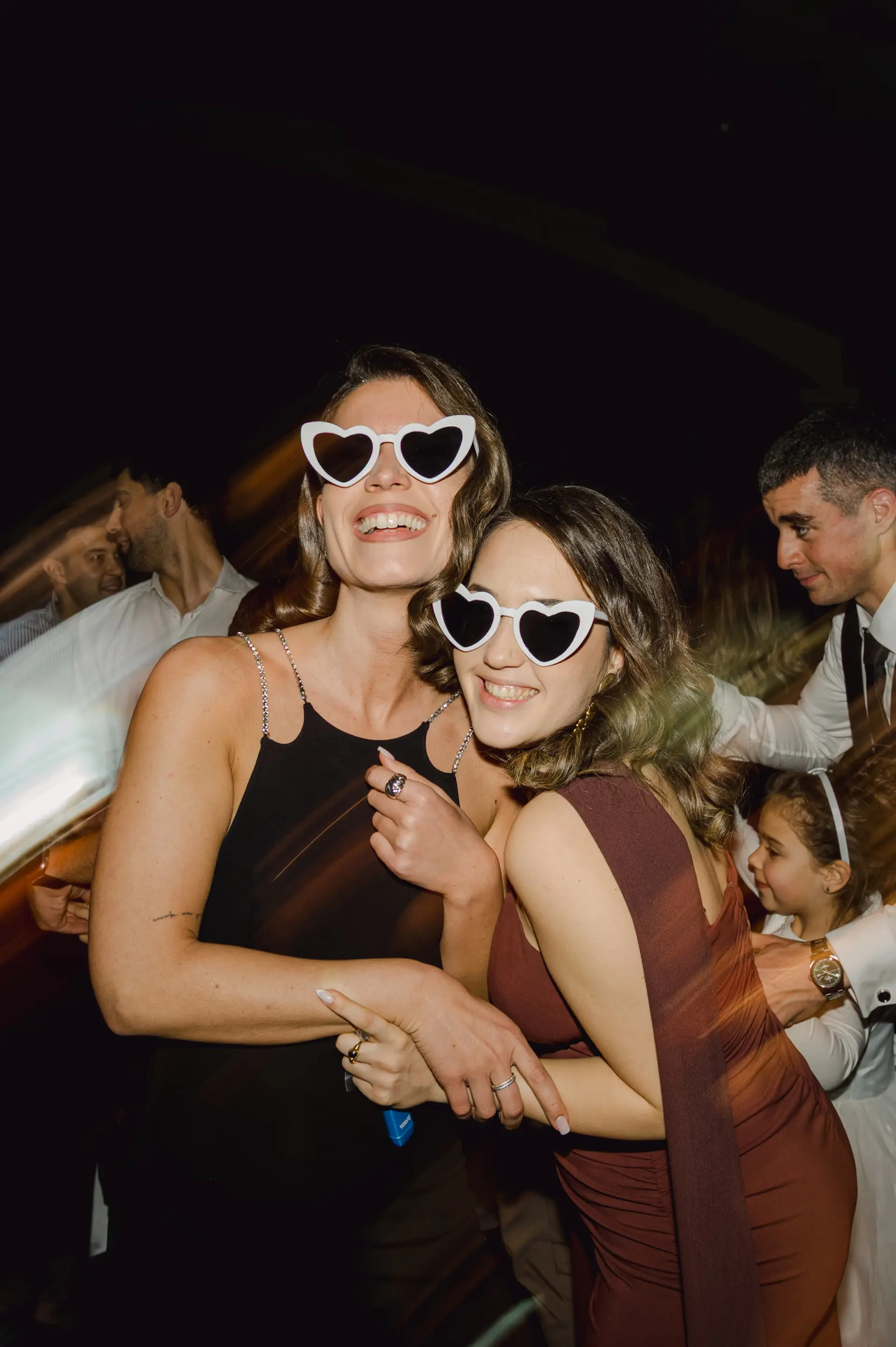 bride's friends with sunglasses on the dance floor