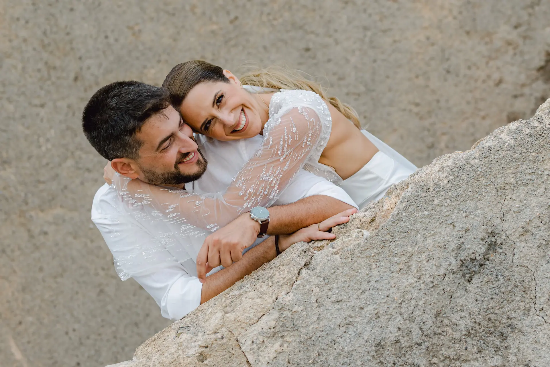 a man and woman hugging each other