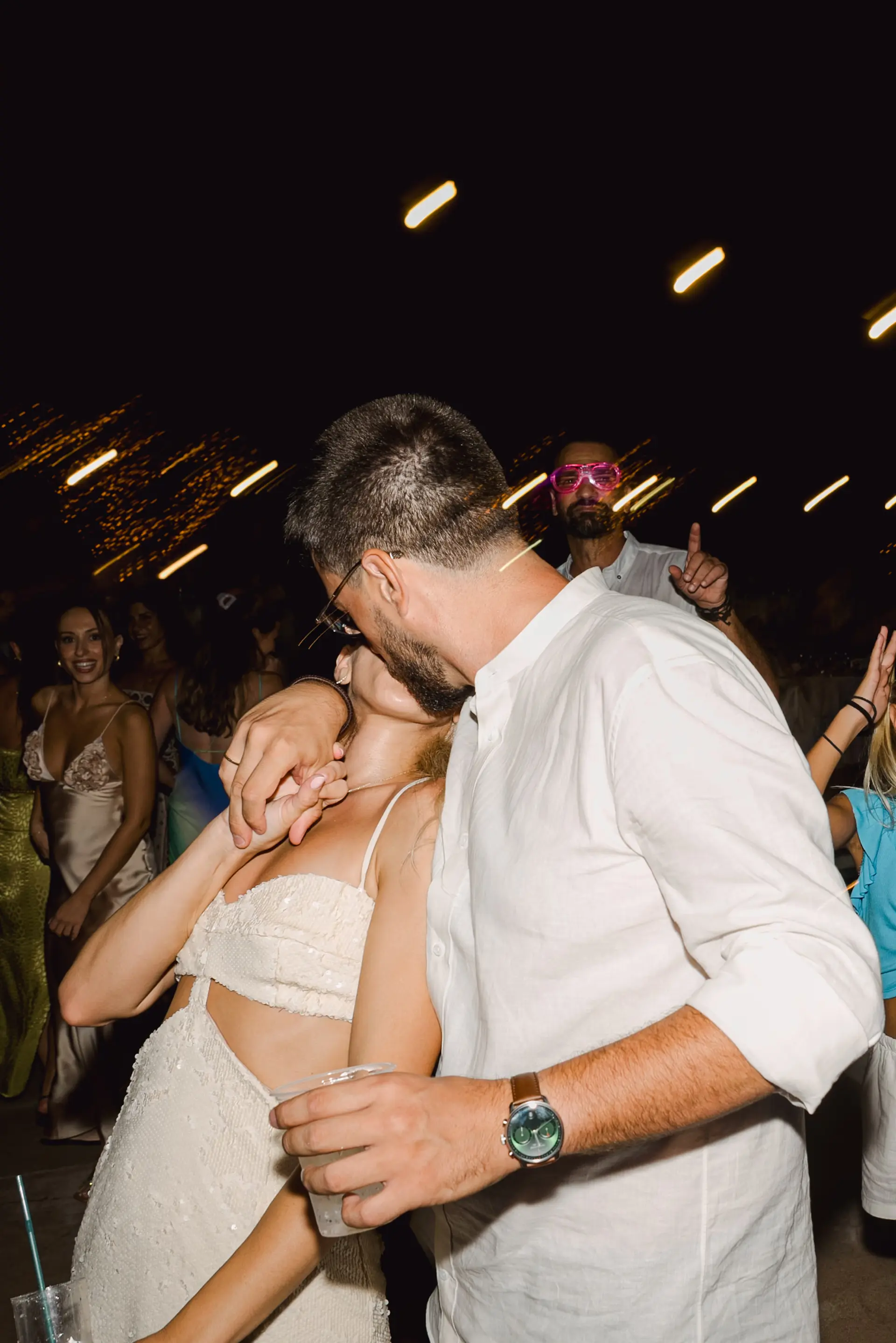 bride and groom kissing in the dancefloor
