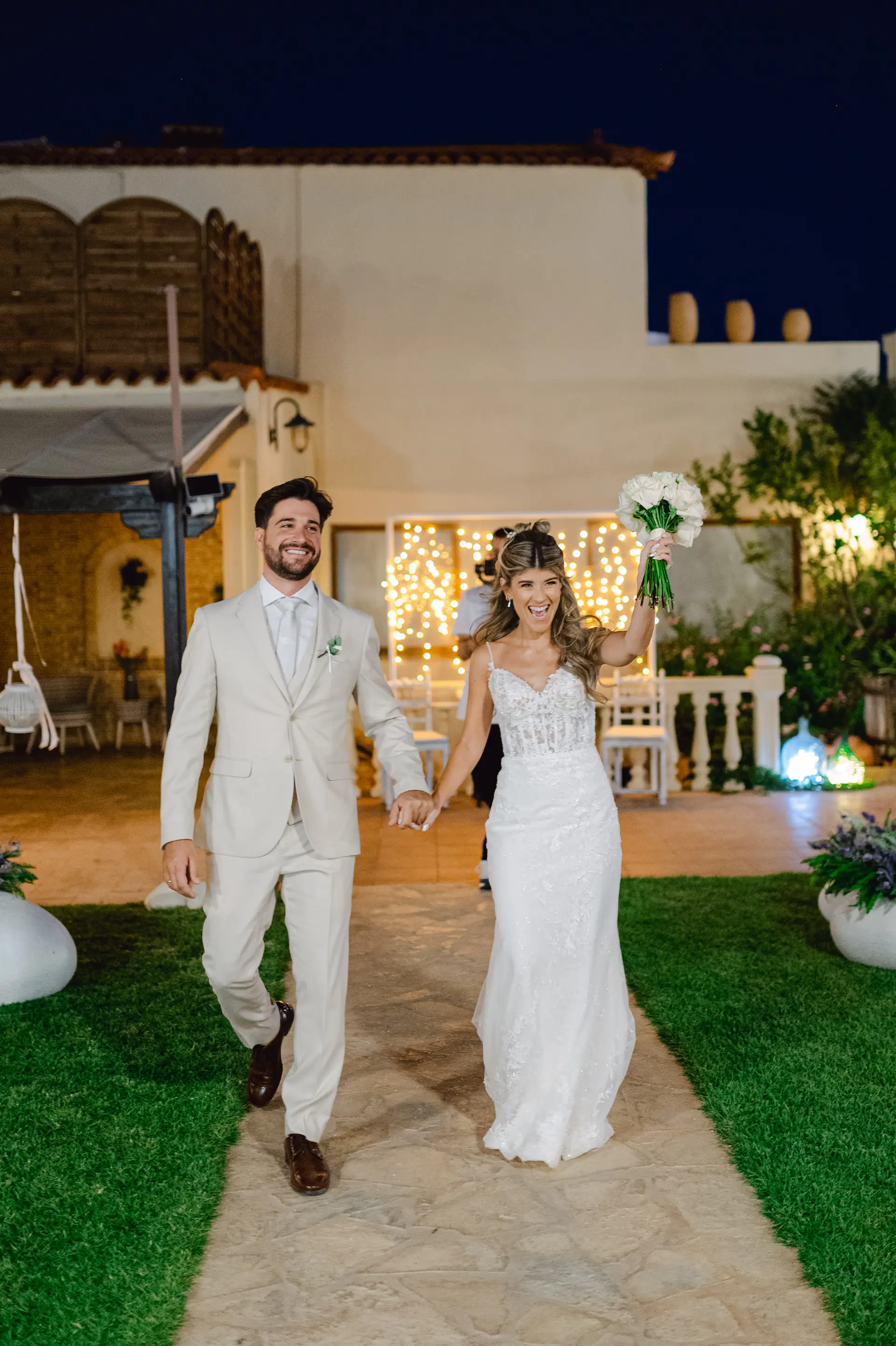 Bride and groom walking down the aisle together after their wedding ceremony