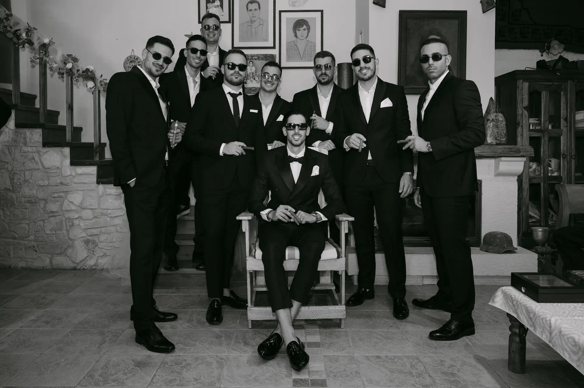 Elegant groom and his groomsmen getting ready, capturing the fine details of wedding suits and style.