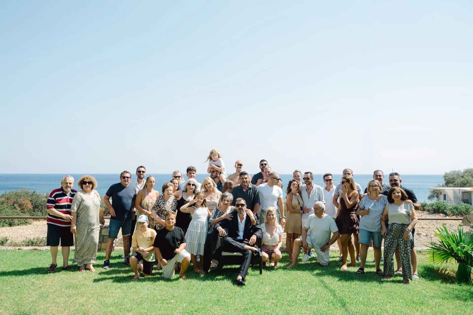 groom friends and family posing for a group photo