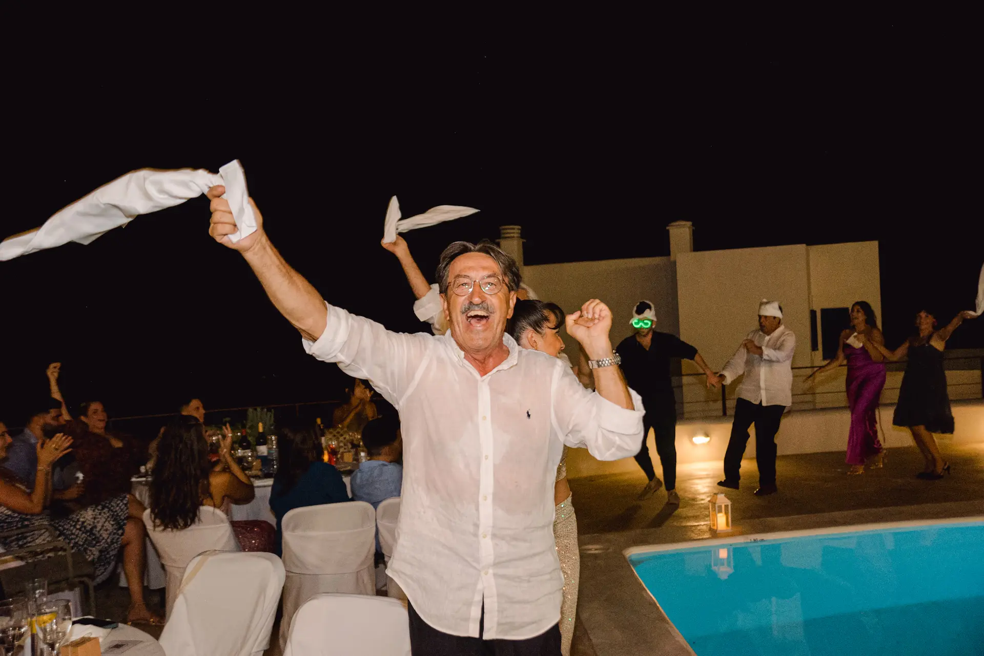 a man throwing napkins in the air