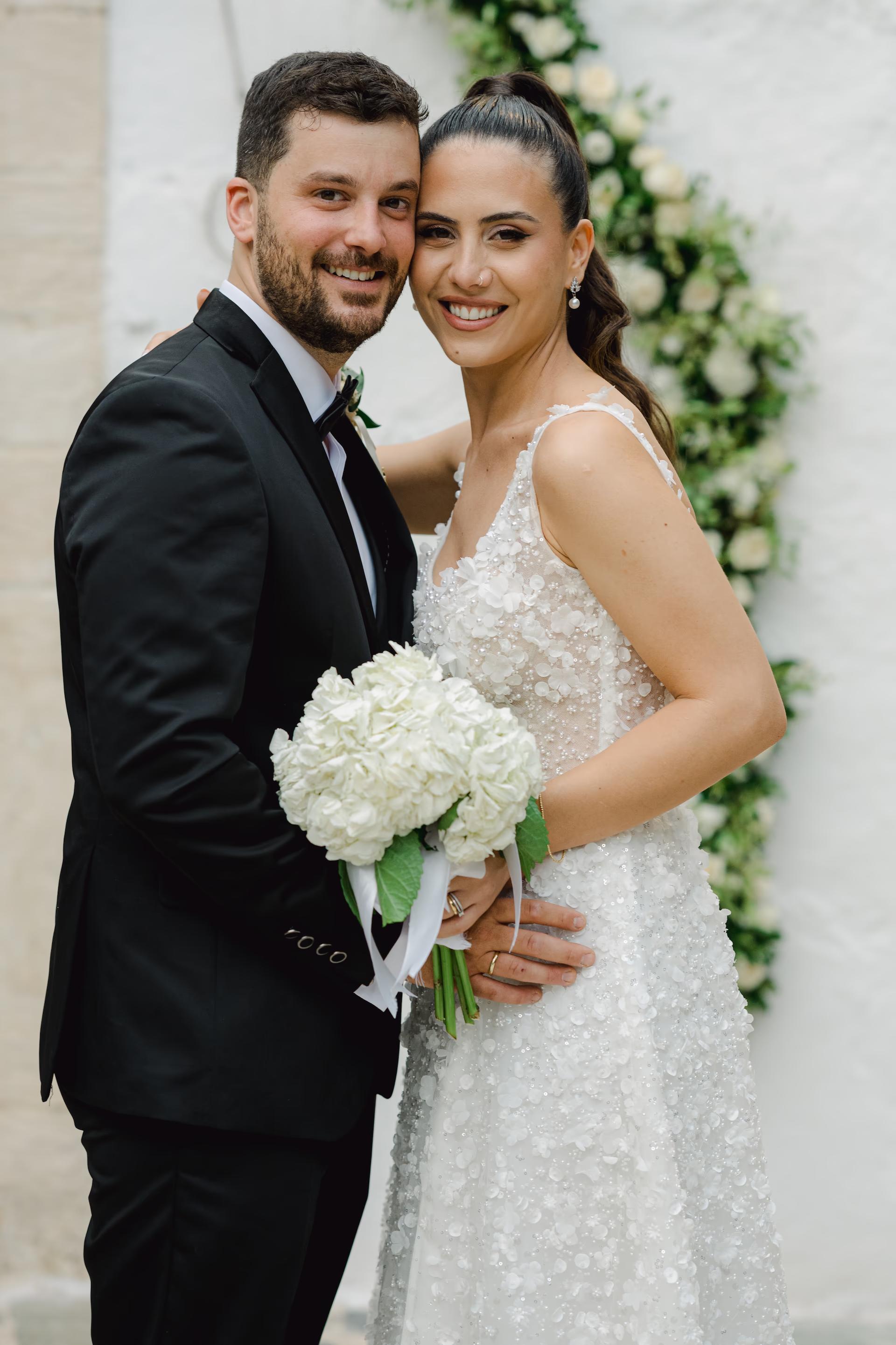 bride and groom portrait in front of church