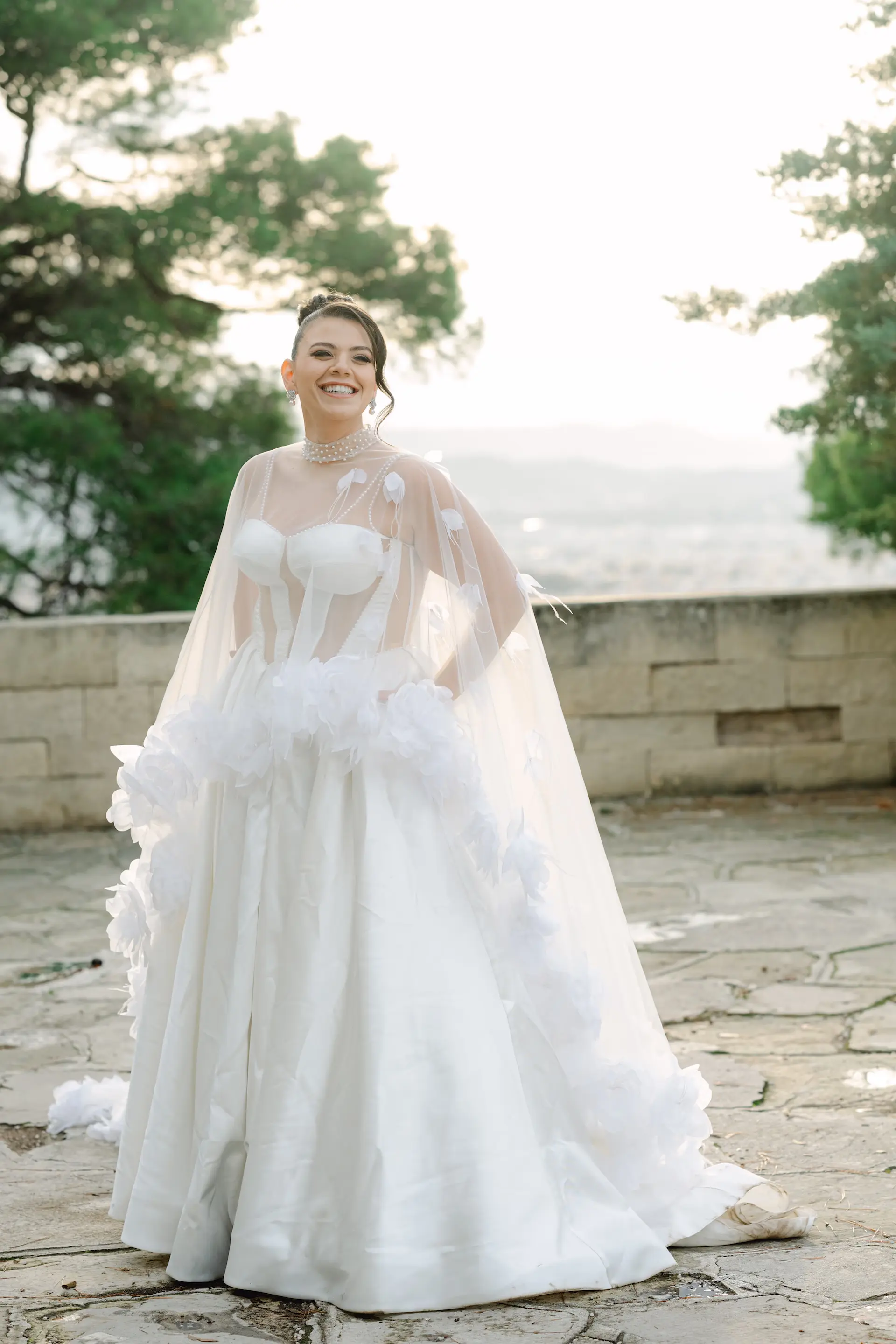 happy bride posing for a smiley portrait in natural light
