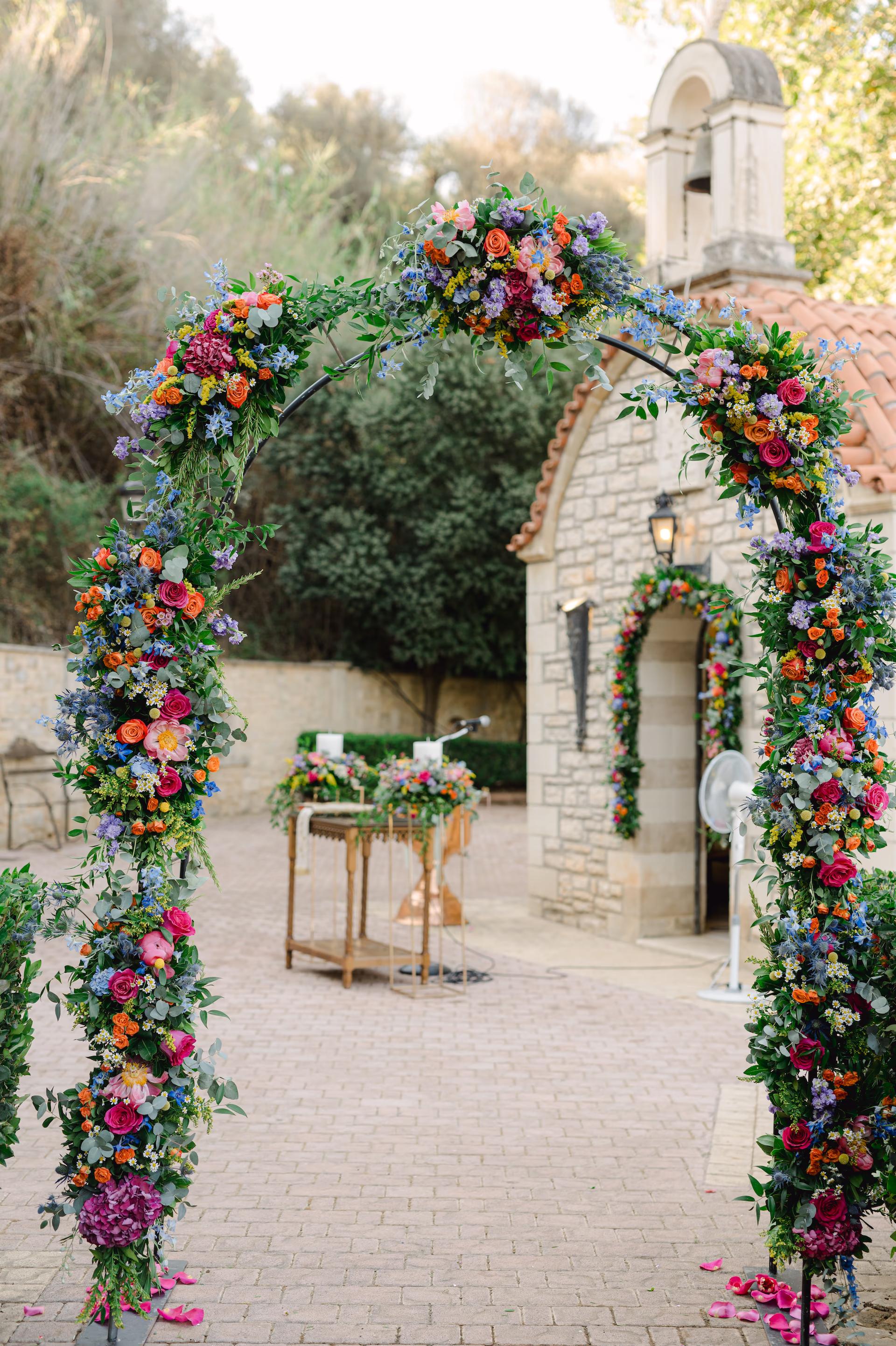 a flower arch with flowers on it, wedding church decoration