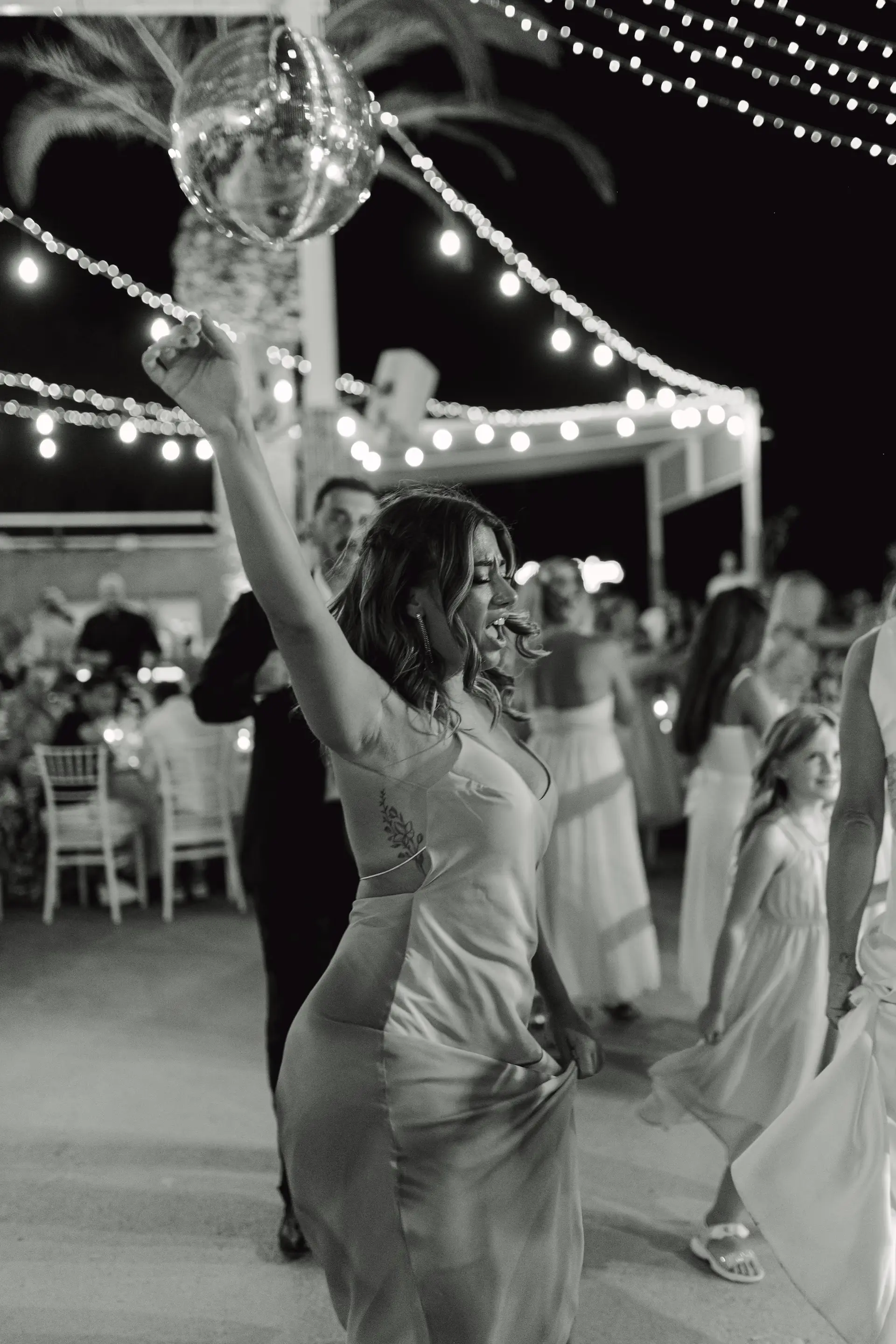 a woman dancing full of energy in black and white