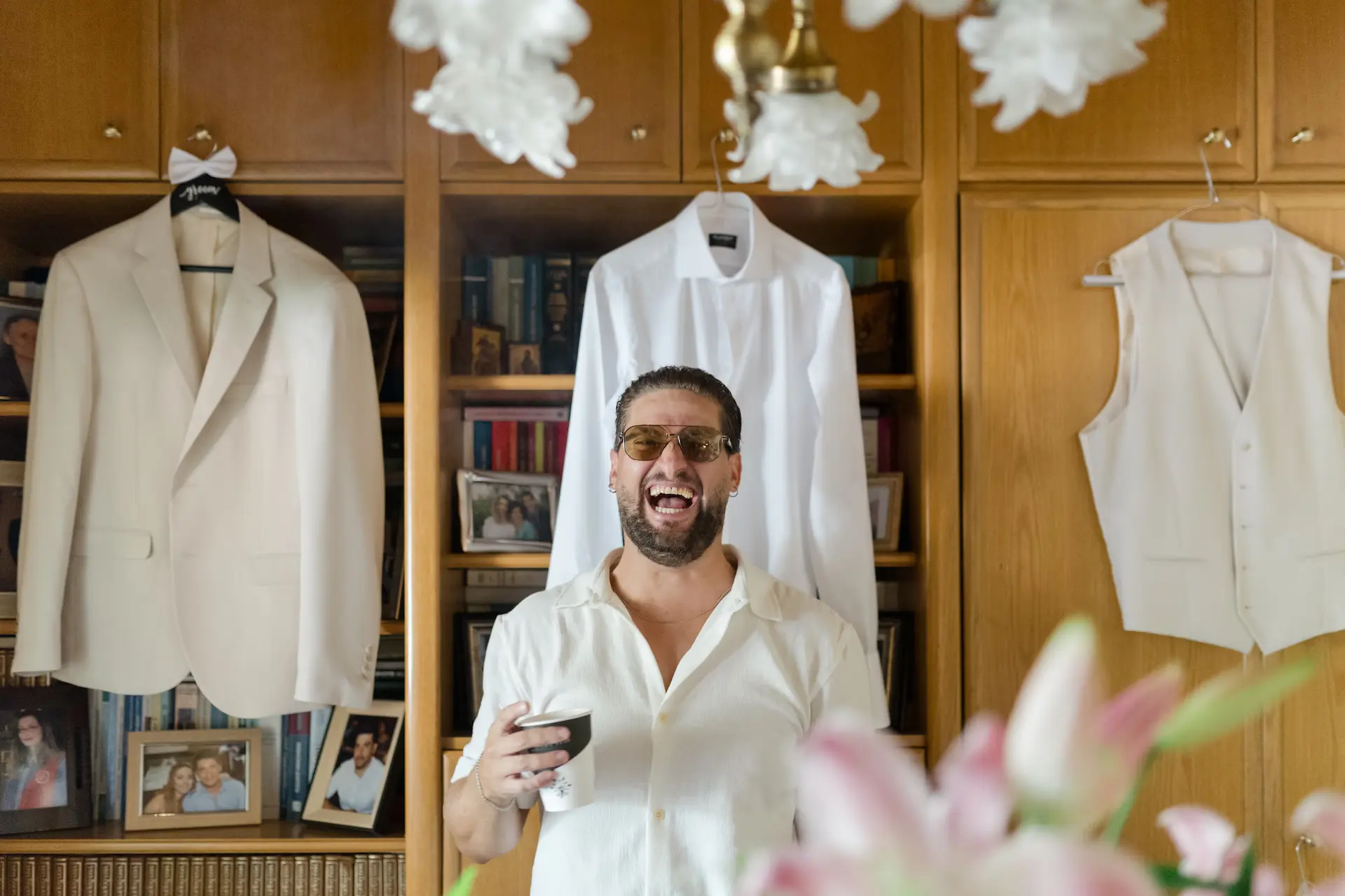 best man photo bombing the groom suit photo