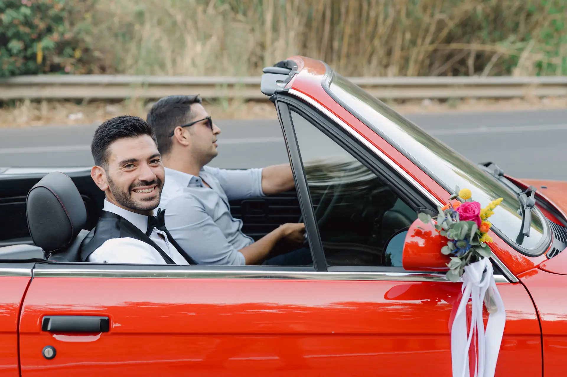 two men in a car