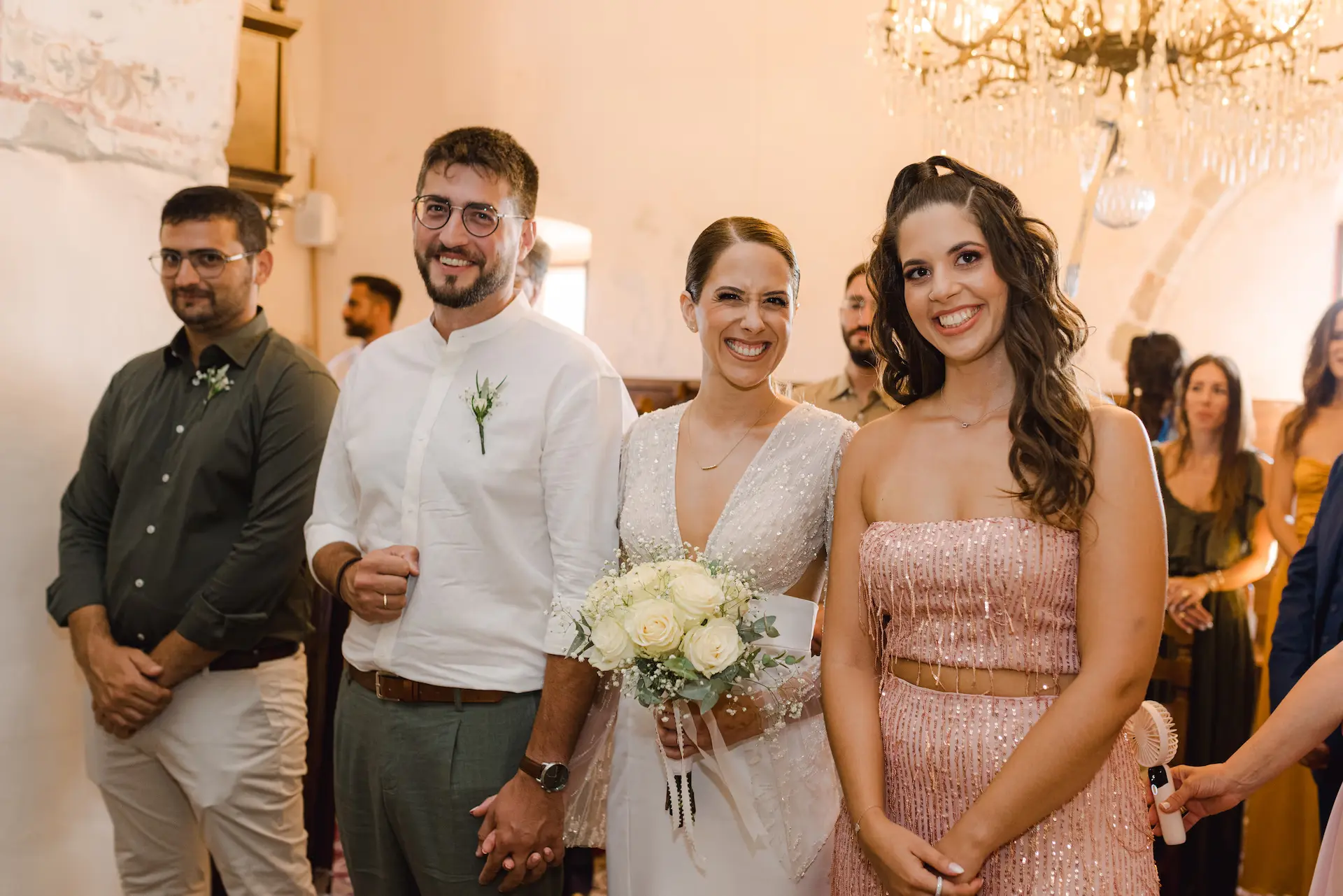 Bride, groom, best man, and maid of honor during the wedding ceremony