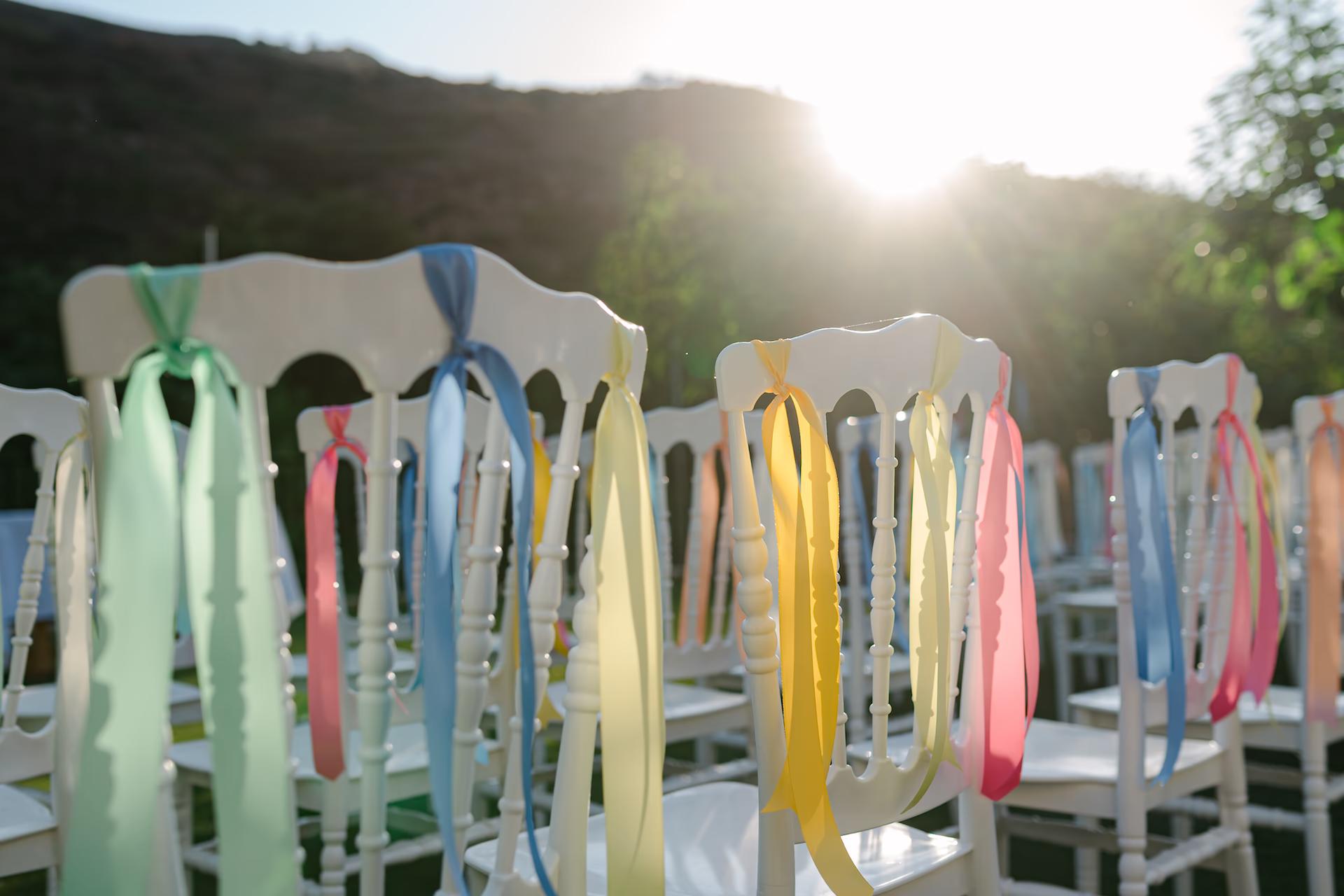 Wedding chairs decorated with ribbons