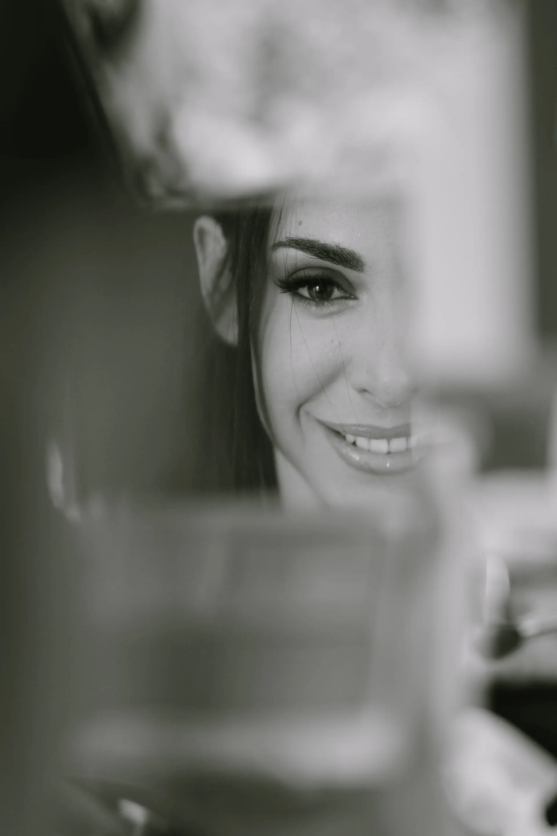 black and white artistic photo of the bride looking at the camera