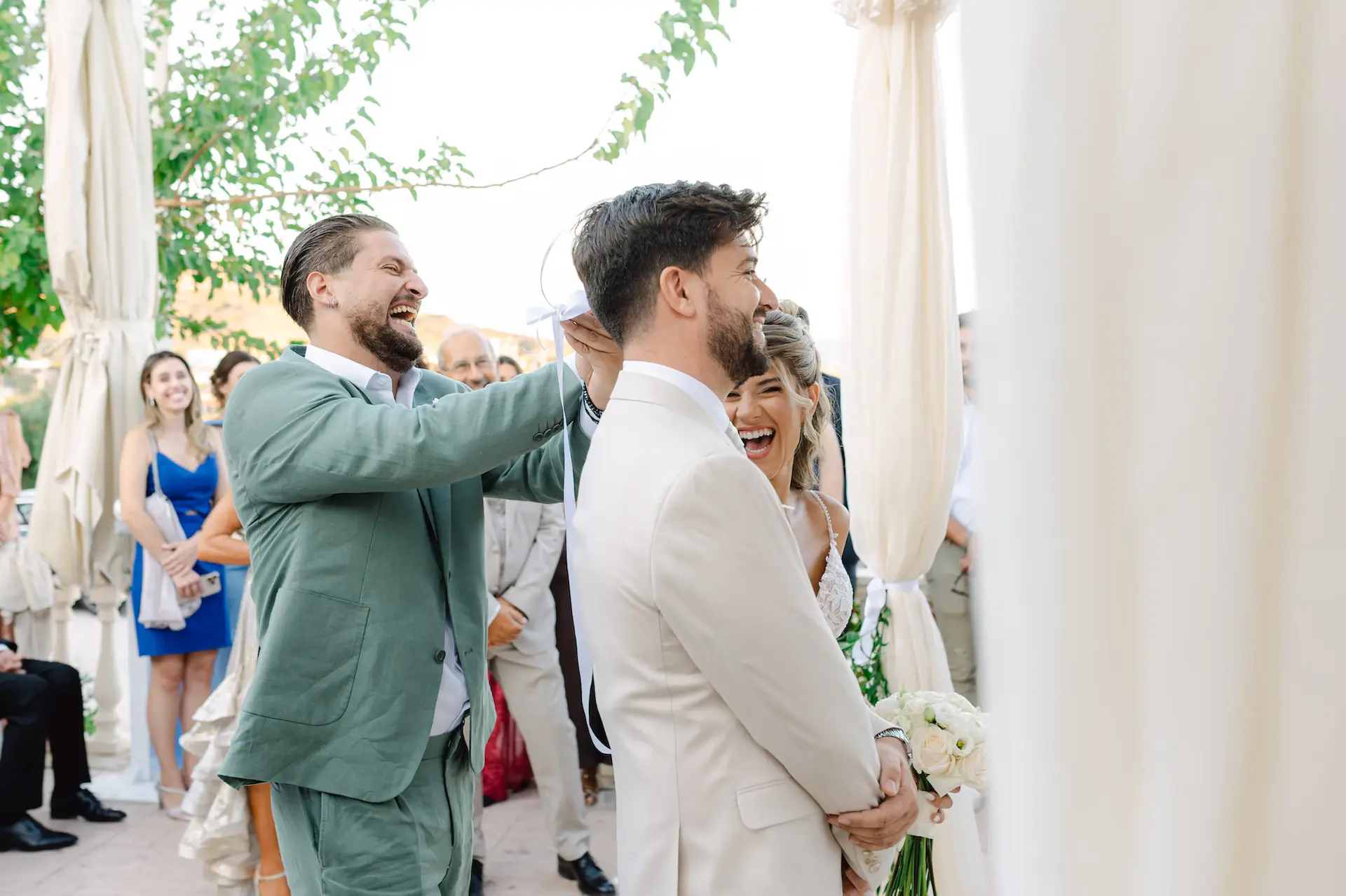 Spontaneous laughter and genuine happiness captured during the wedding celebration