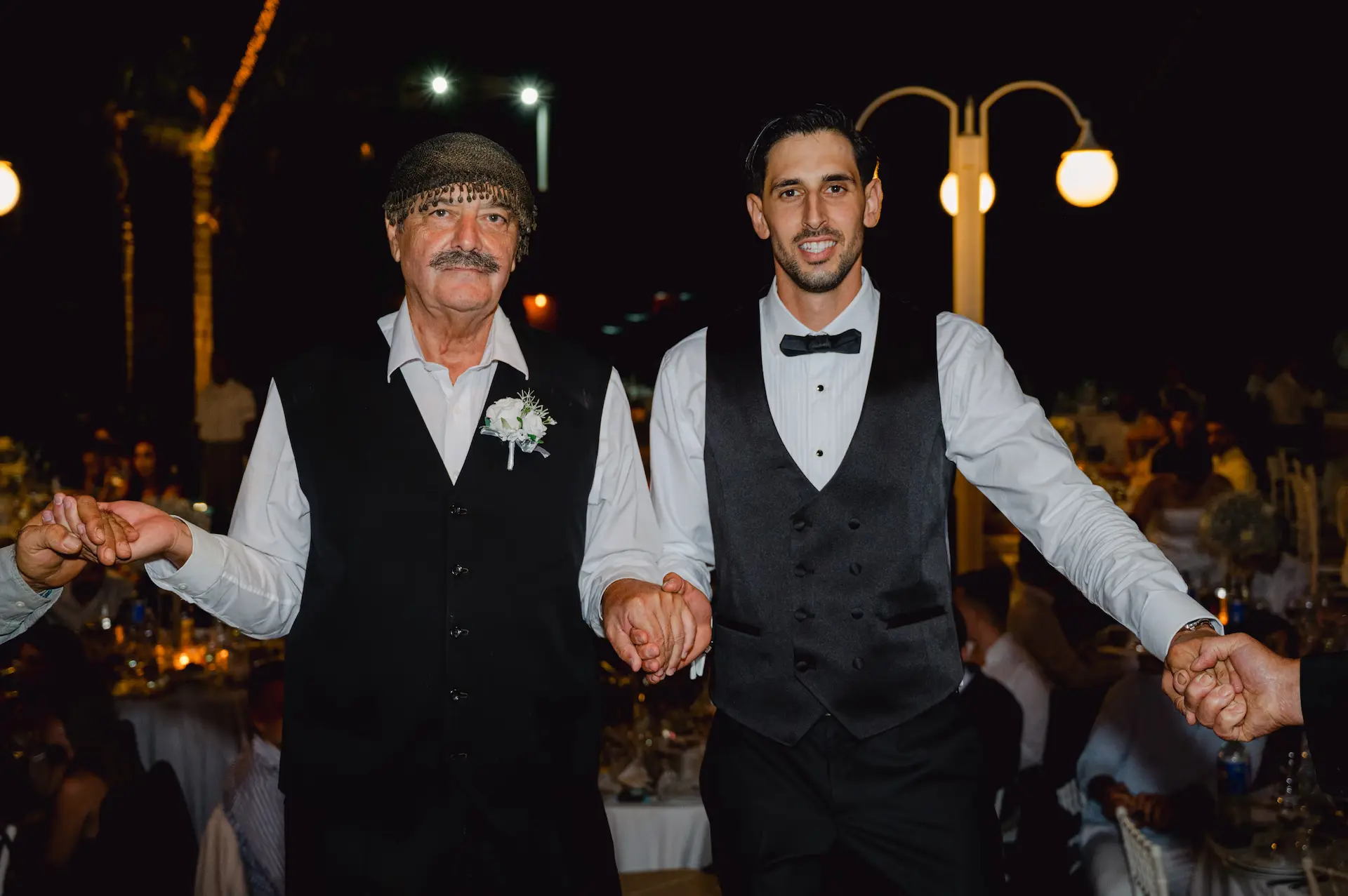 groom and his father during tradiational cretan dance