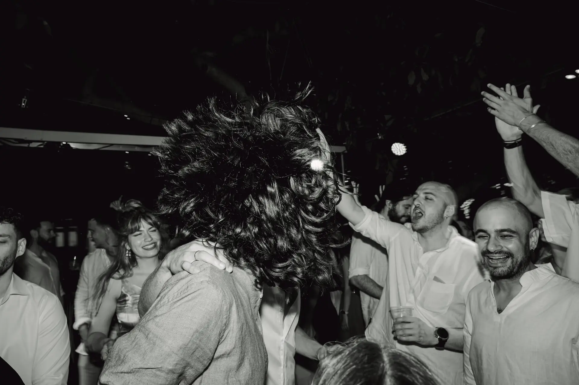 a group of guests dancing