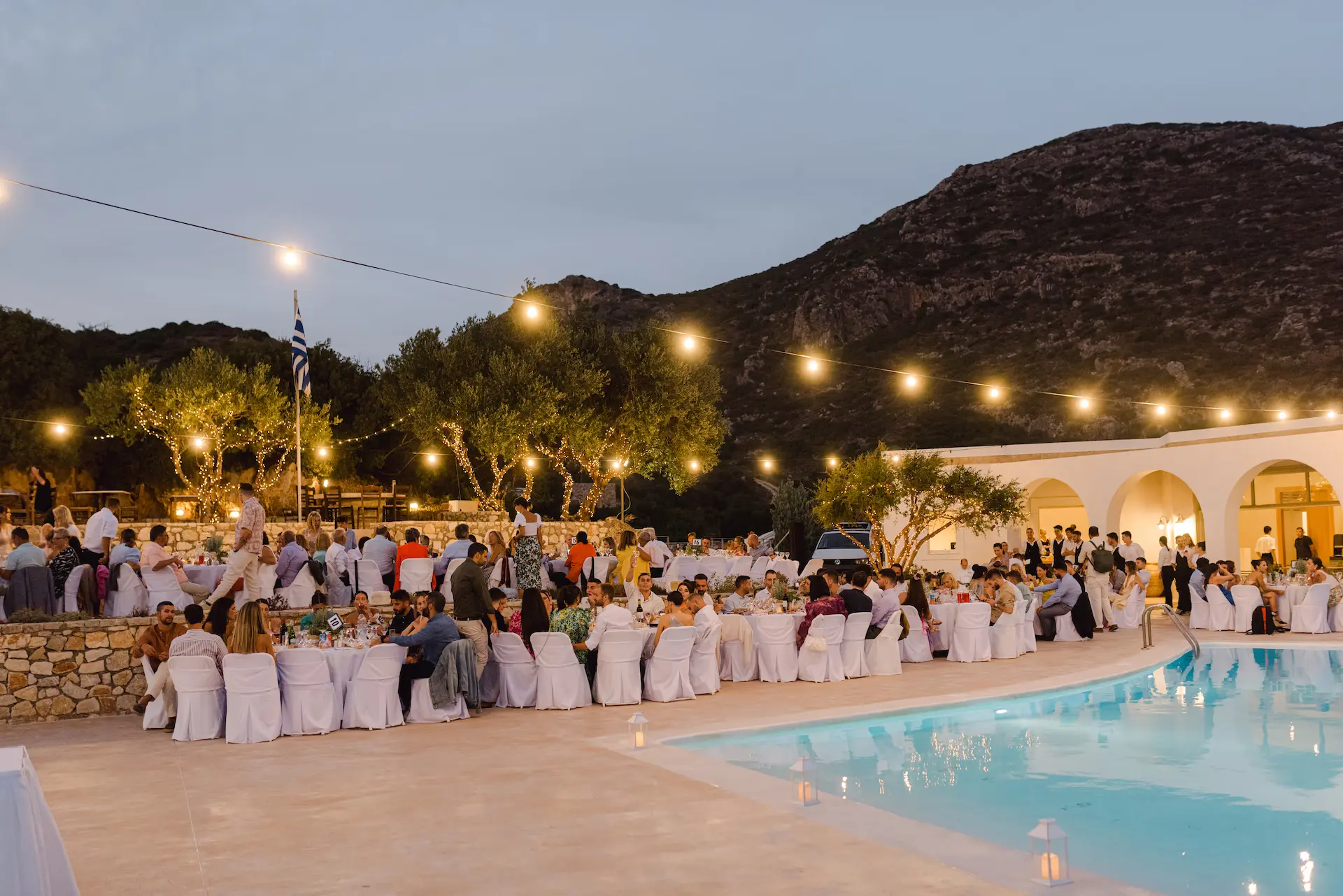 wedding ceremony at late sunset next to a pool