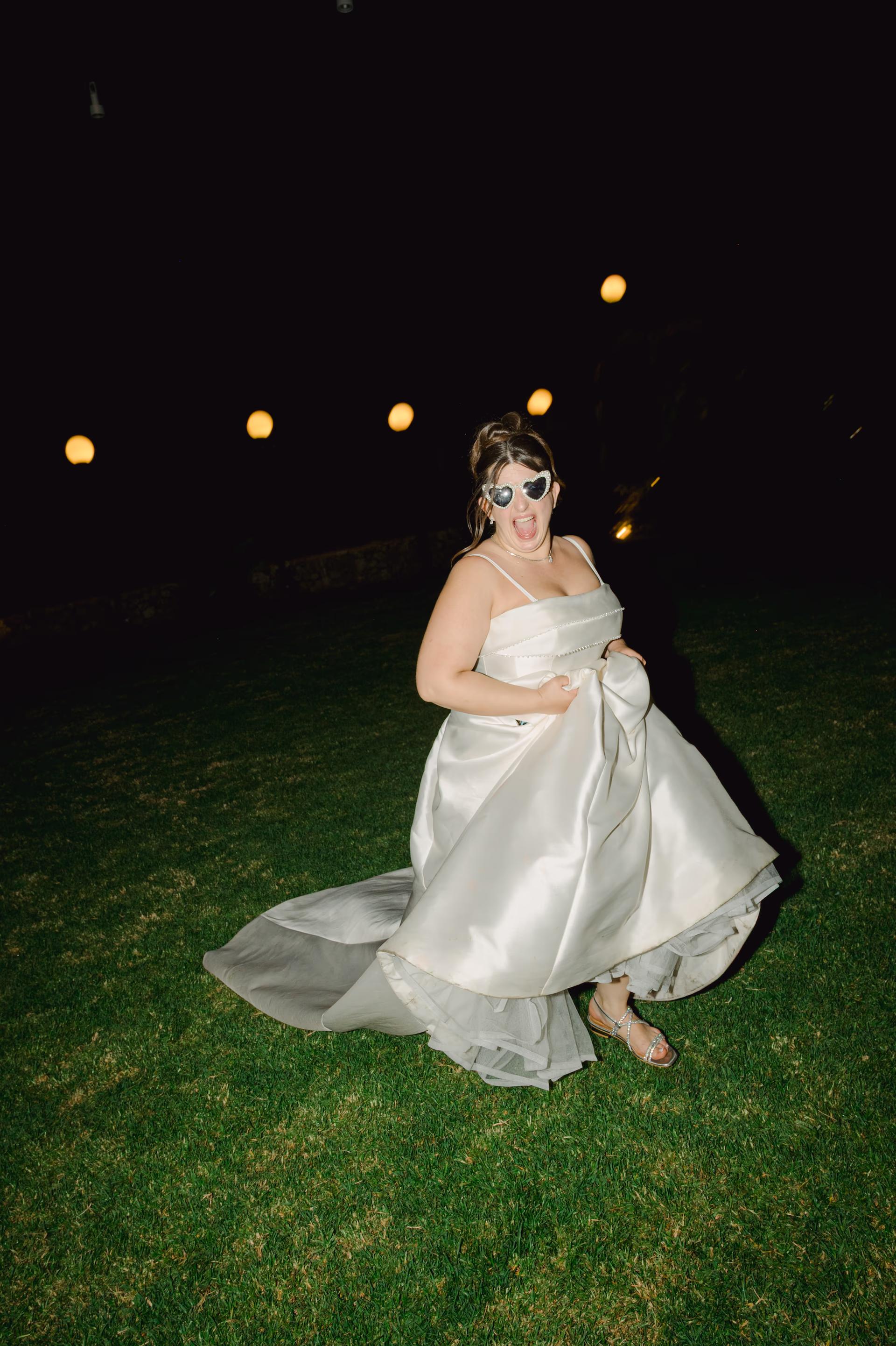 Bride running happily during wedding party at Limnoupolis in Chania