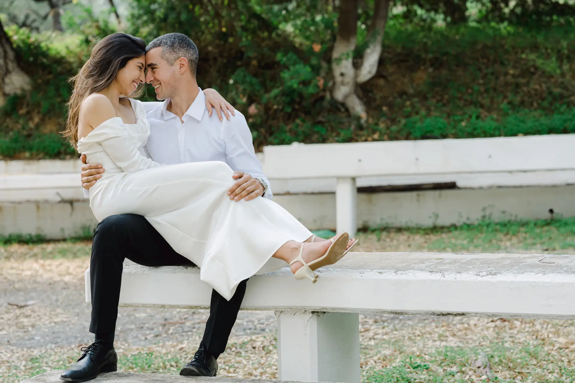 romantic moment of bride and groom during photoshoot
