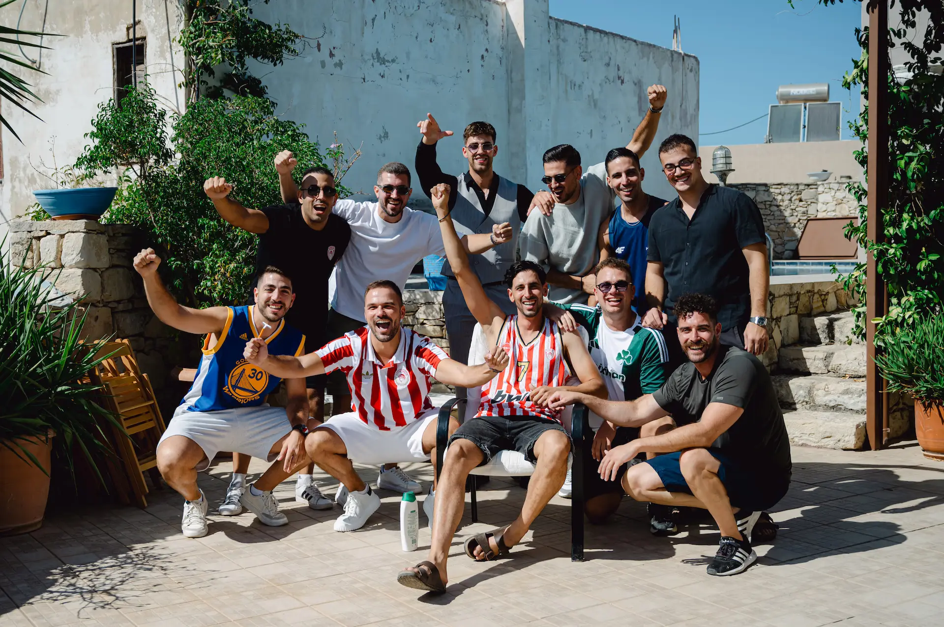 groom with his friends posing during his preparation
