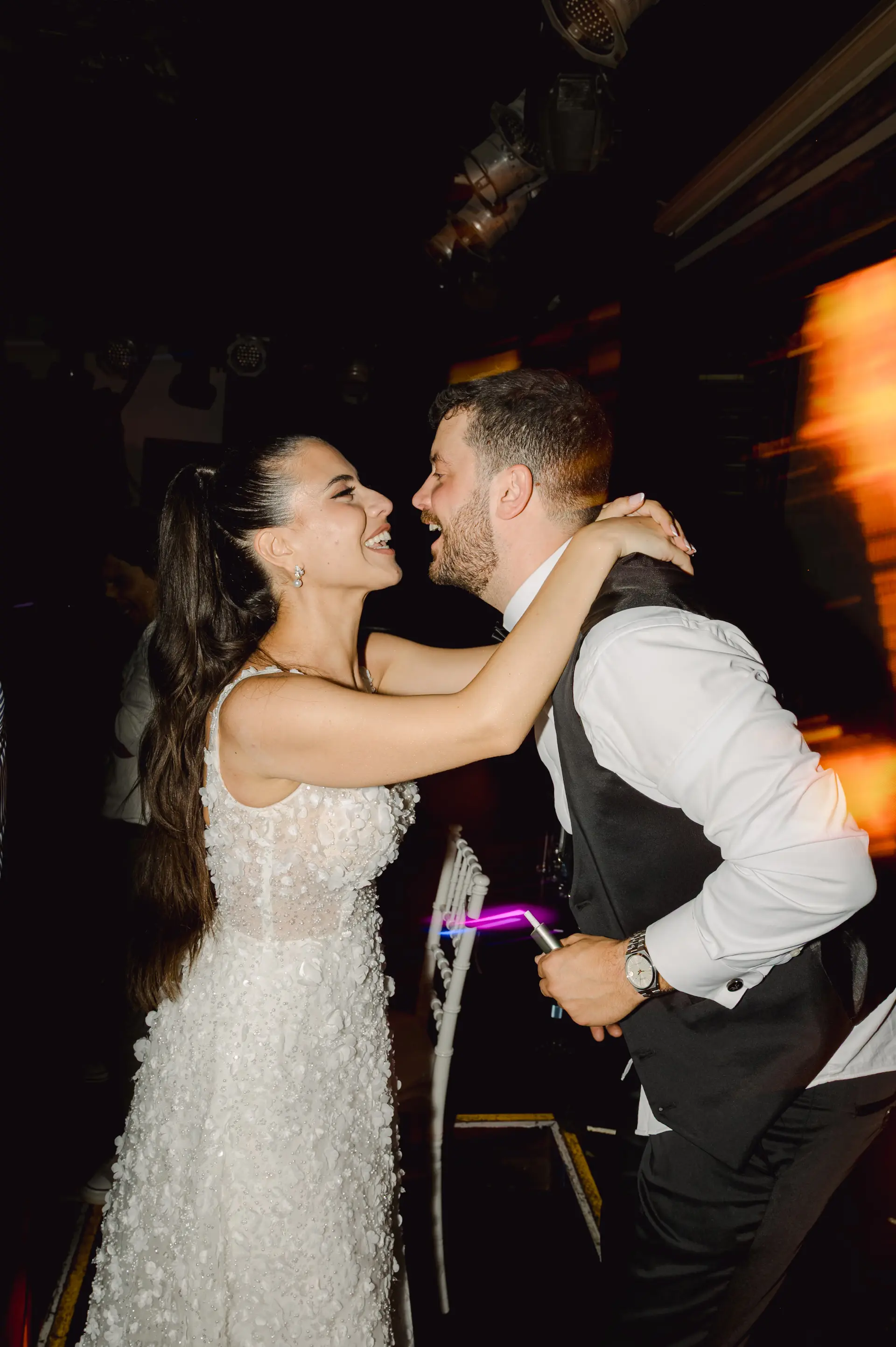 bride and groom dancing during wedding party in Portokali venue, Chania