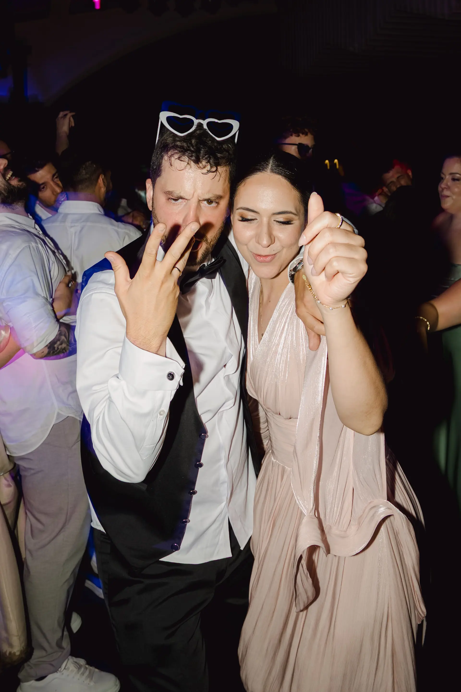 a man and woman dancing in Portokali hall dance floor