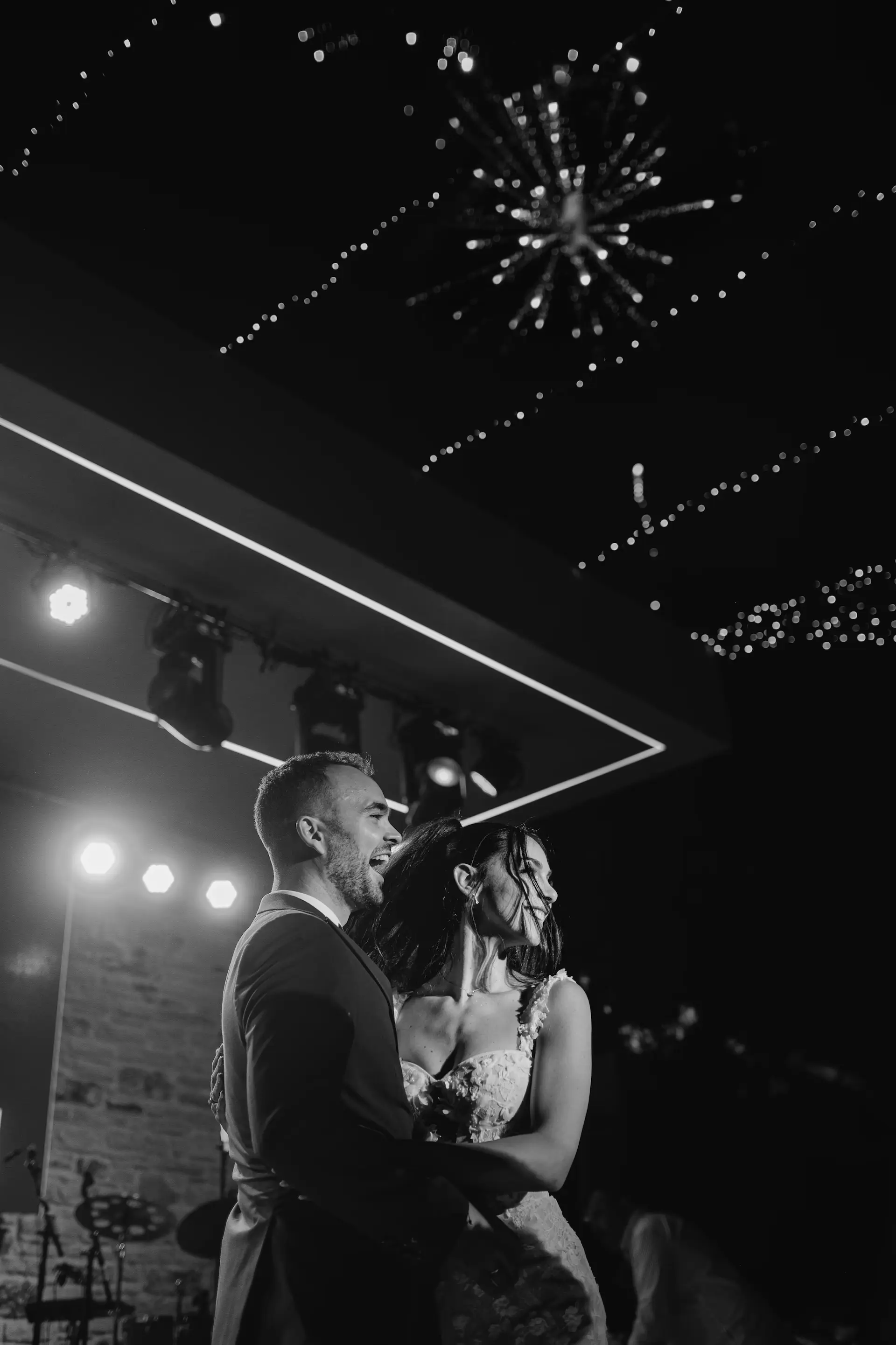 energy moment during couple's first dance in front of fireworks