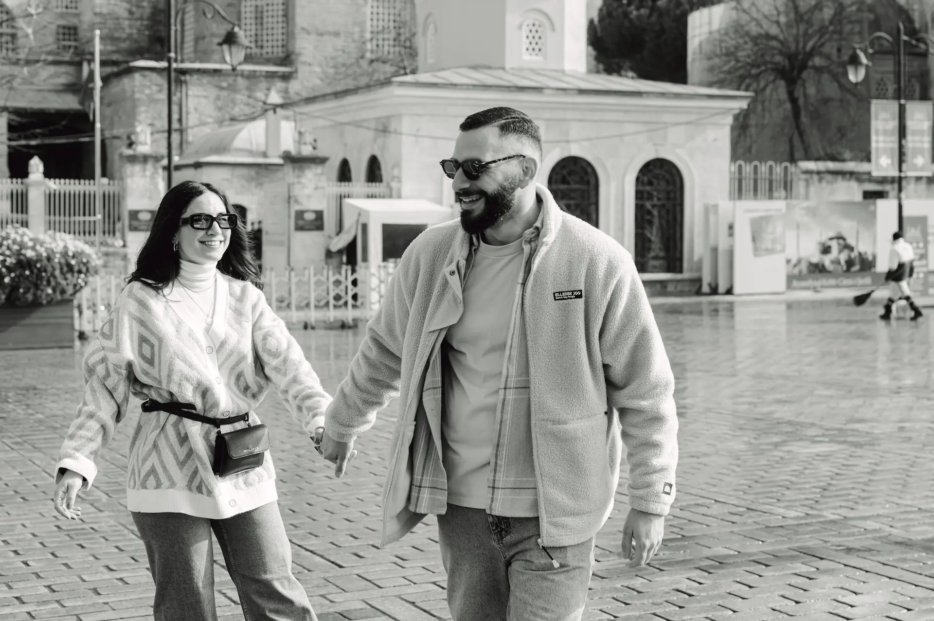 a man and woman holding hands