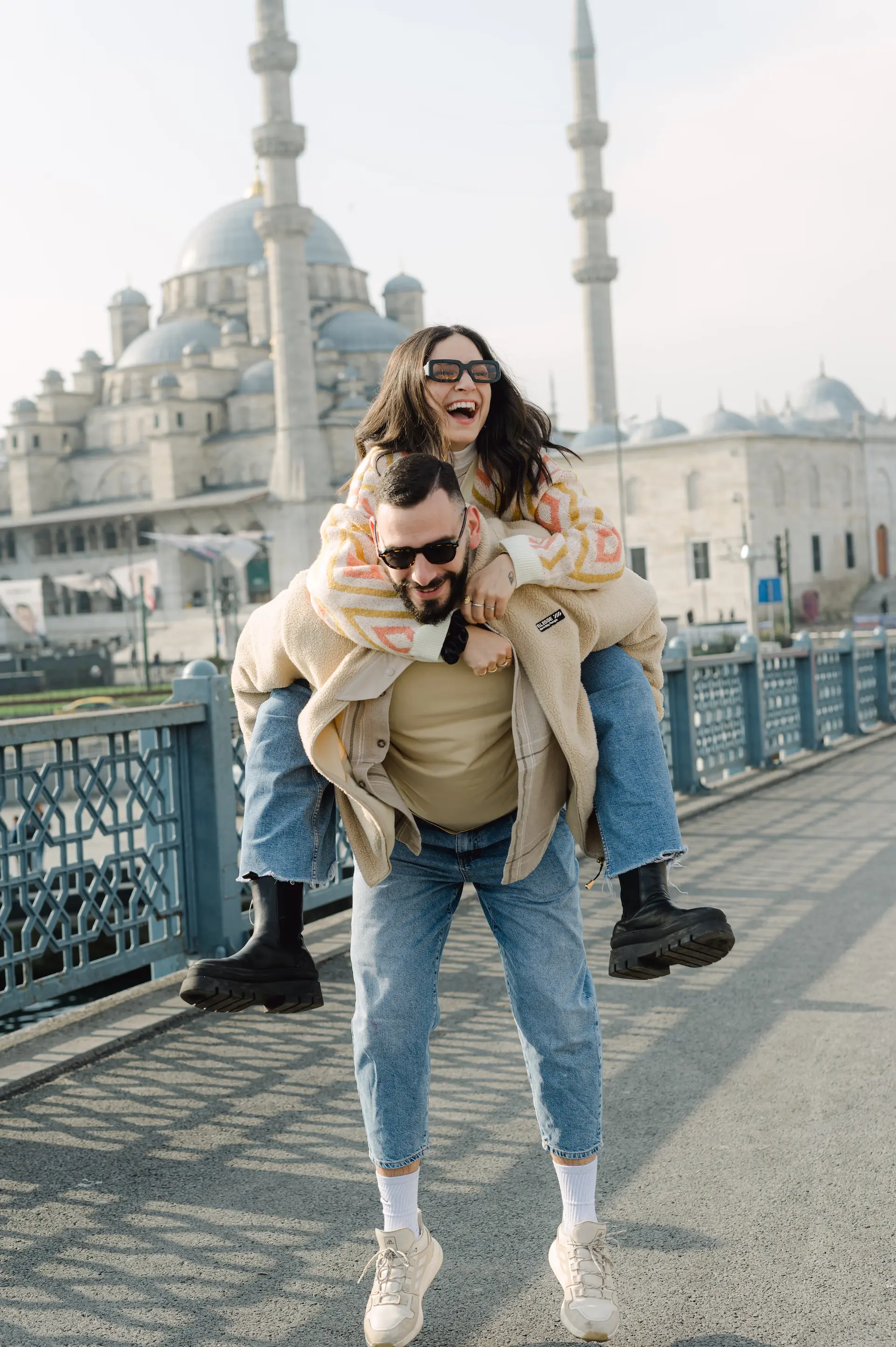 a man carrying a woman on his back