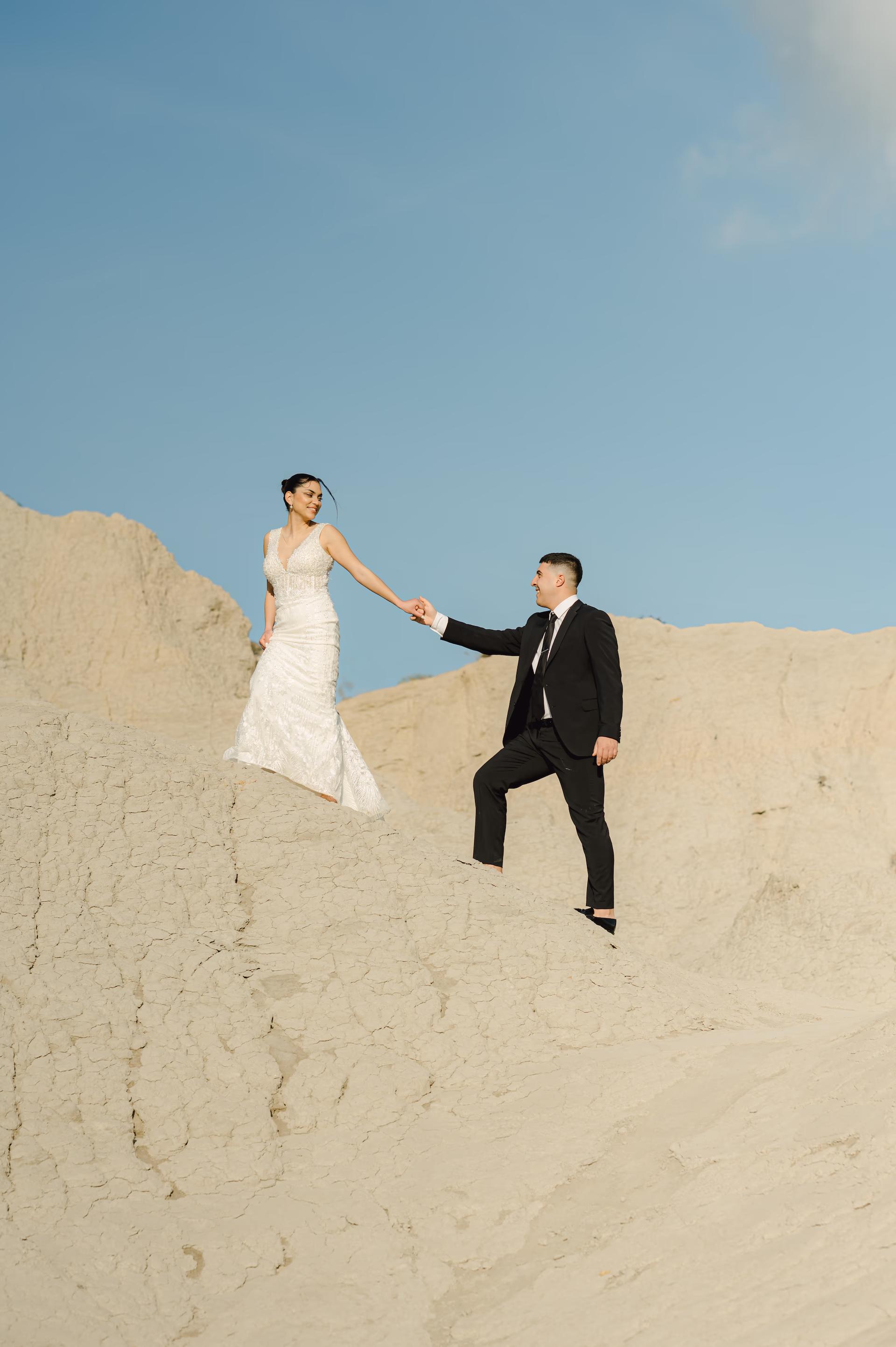 Artistic next day wedding photoshoot on the rugged cliffs of Komolithoi, kissamos
