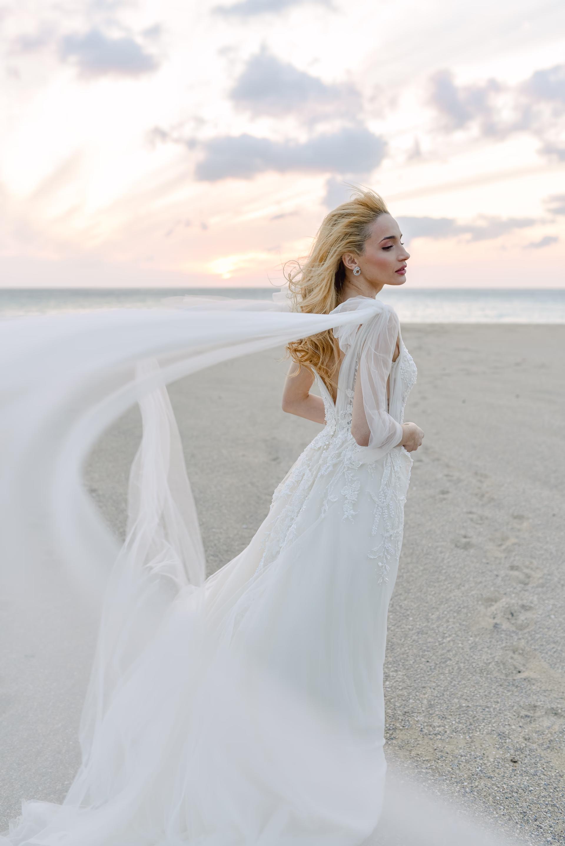 Ethereal bride in a white gown posing at Falasarna beach, a premier destination wedding location in Chania