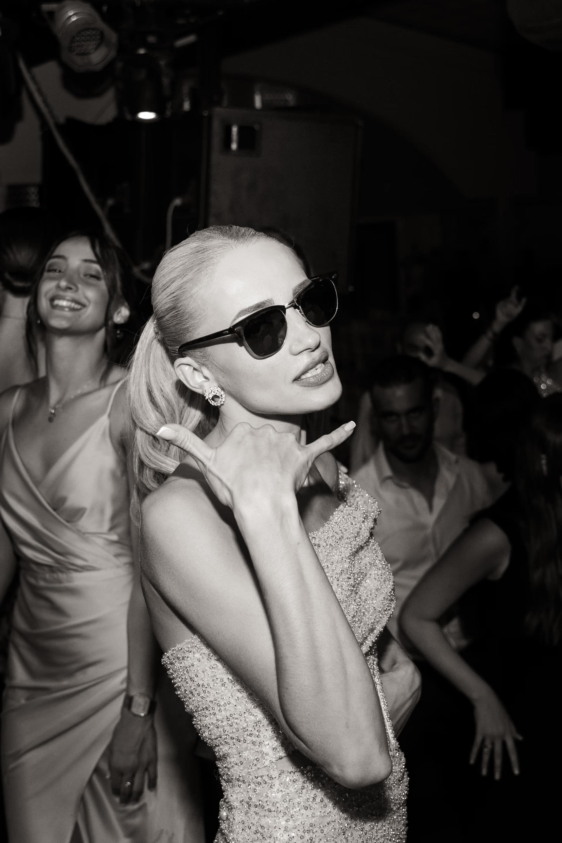 Bride wearing sunglasses partying at wedding reception Portokali