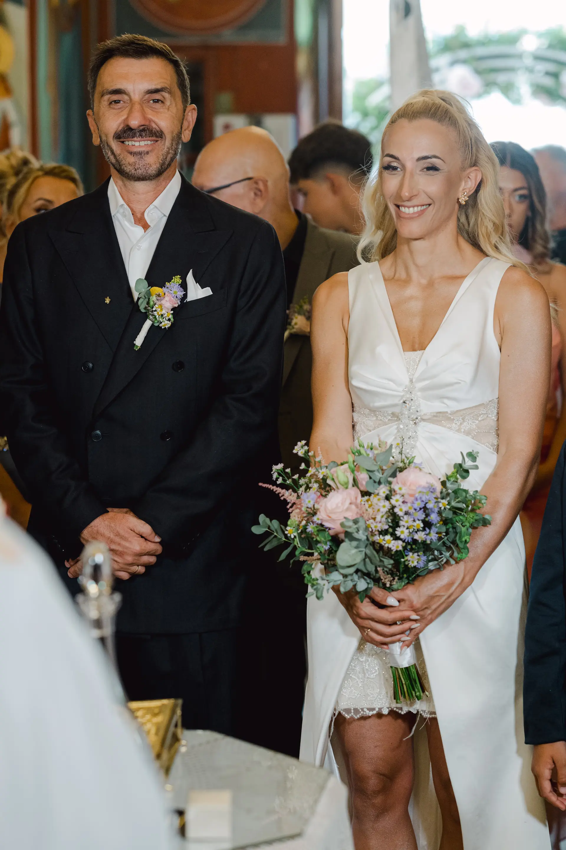 Intimate portrait of the bride and groom during their wedding ceremony, capturing their authentic chemistry and shared emotion.