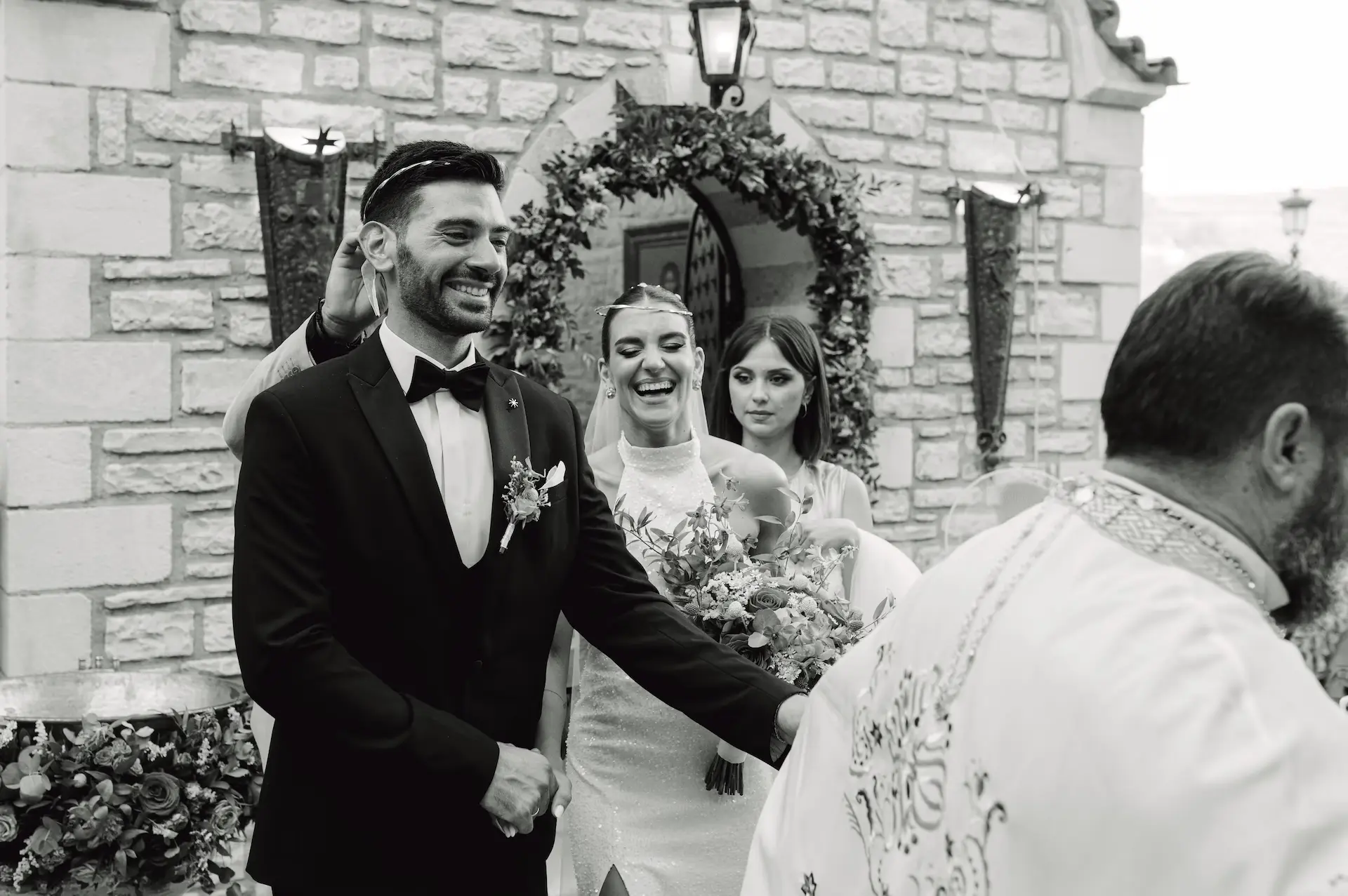a man in a suit and a woman in a tuxedo and a man in a tuxedo